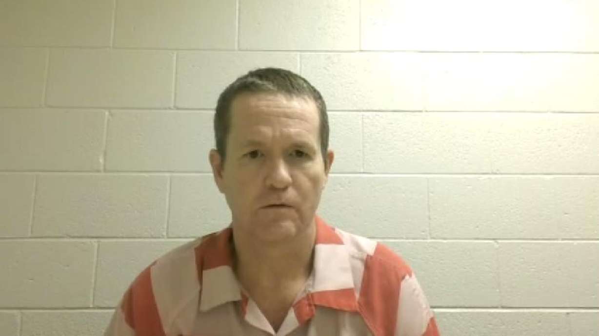 Michael Jayne listens to a hearing from the Utah County Jail on Friday. He is pleading not guilty in the killing of a Santaquin officer.