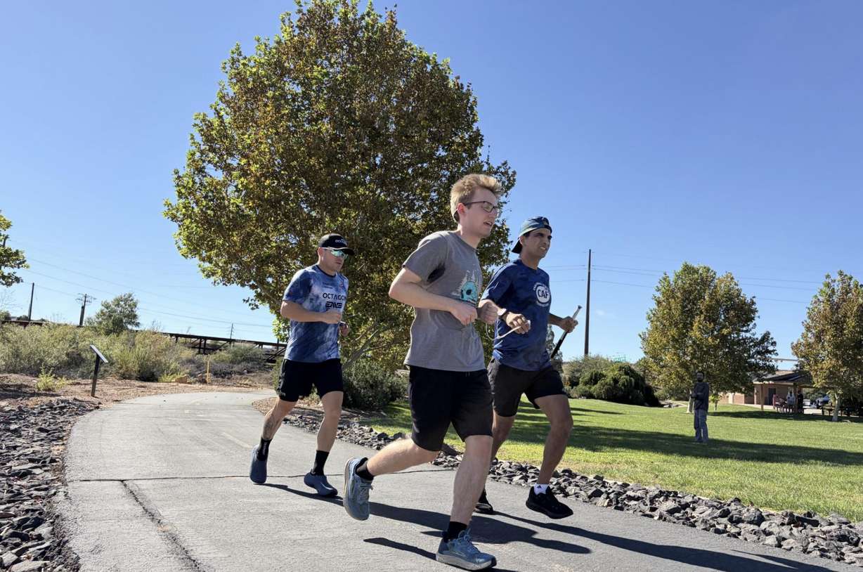 Adrian Broca, 49, is a marathonner and triathlete who is blind. He sill be running the St. George Marathon on Oct. 3 and Nate Arlengo and Sean Feeny will be guiding him on the course.