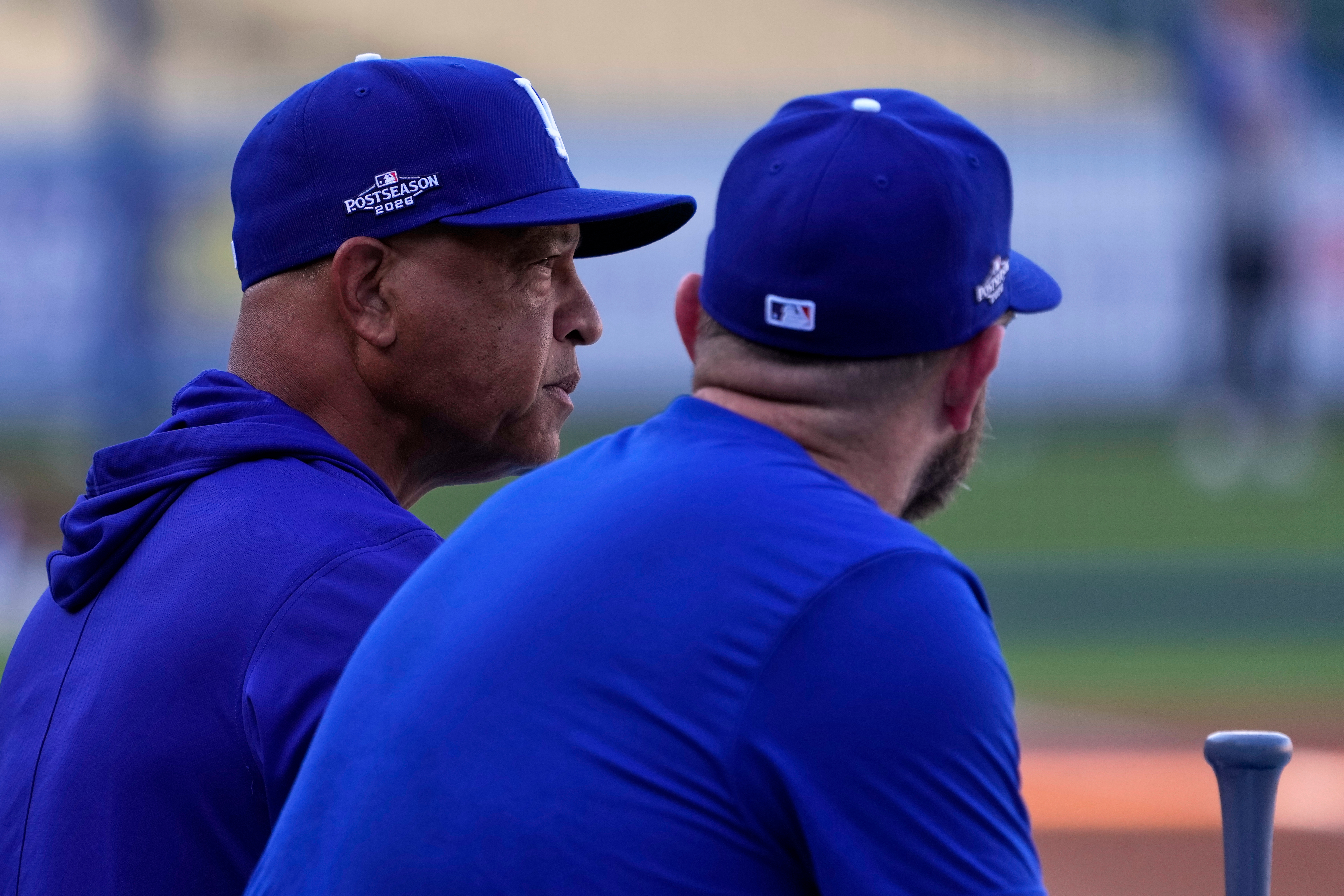 Los Angeles Dodgers manager Dave Roberts, left, talks with third baseman Max Muncy during practice ahead of a baseball NL Division Series Thursday, Oct. 1, 2026, in Los Angeles. 