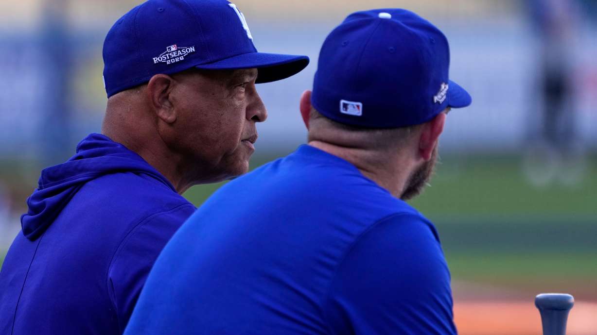 Los Angeles Dodgers manager Dave Roberts, left, talks with third baseman Max Muncy during practice ahead of a baseball NL Division Series Thursday, Oct. 1, 2026, in Los Angeles.