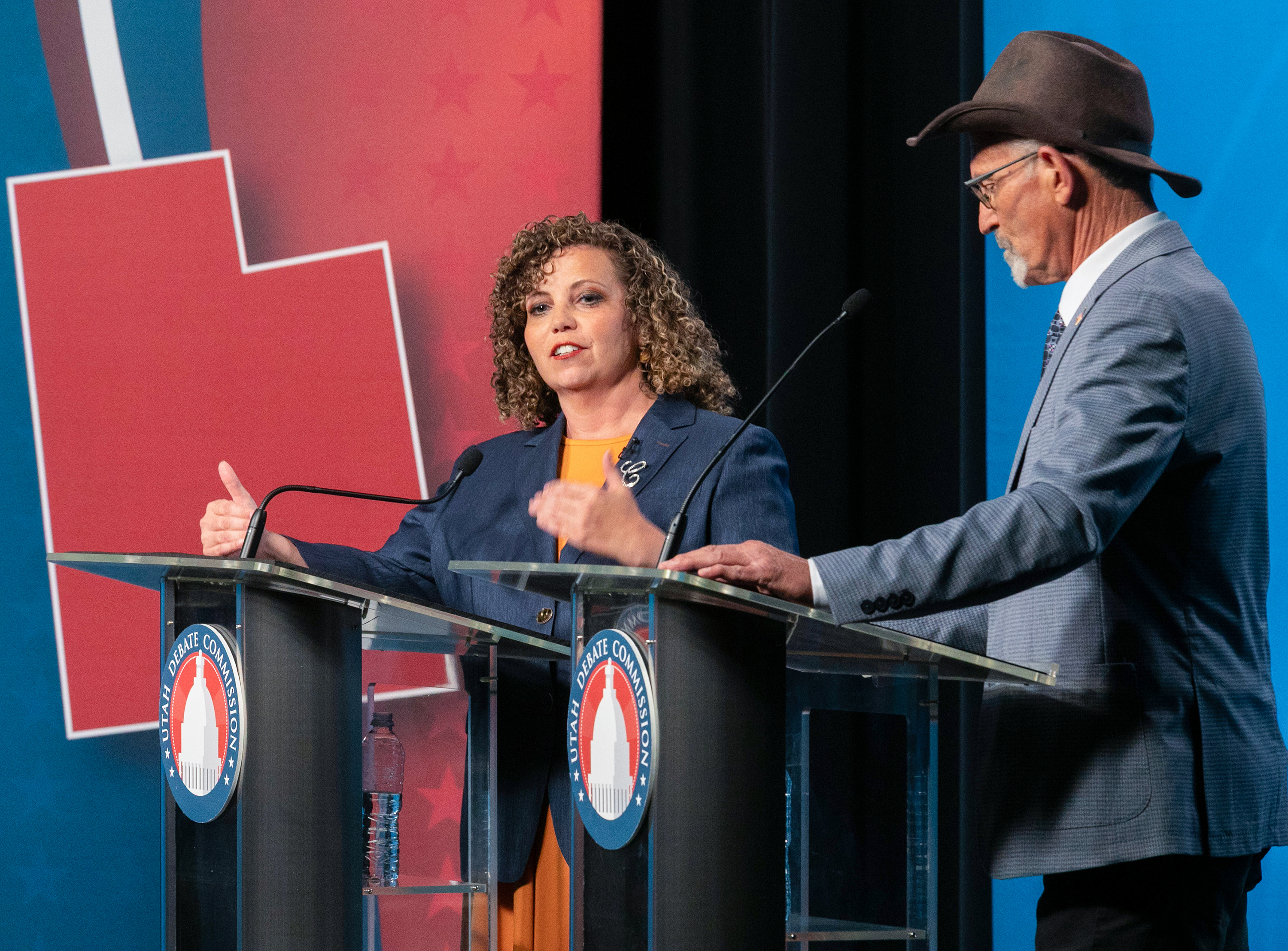 Rep. Celeste Maloy, left, listens as Kent Udell answers a question during a 3rd Congressional District debate at Utah Tech University in St. George, Friday.