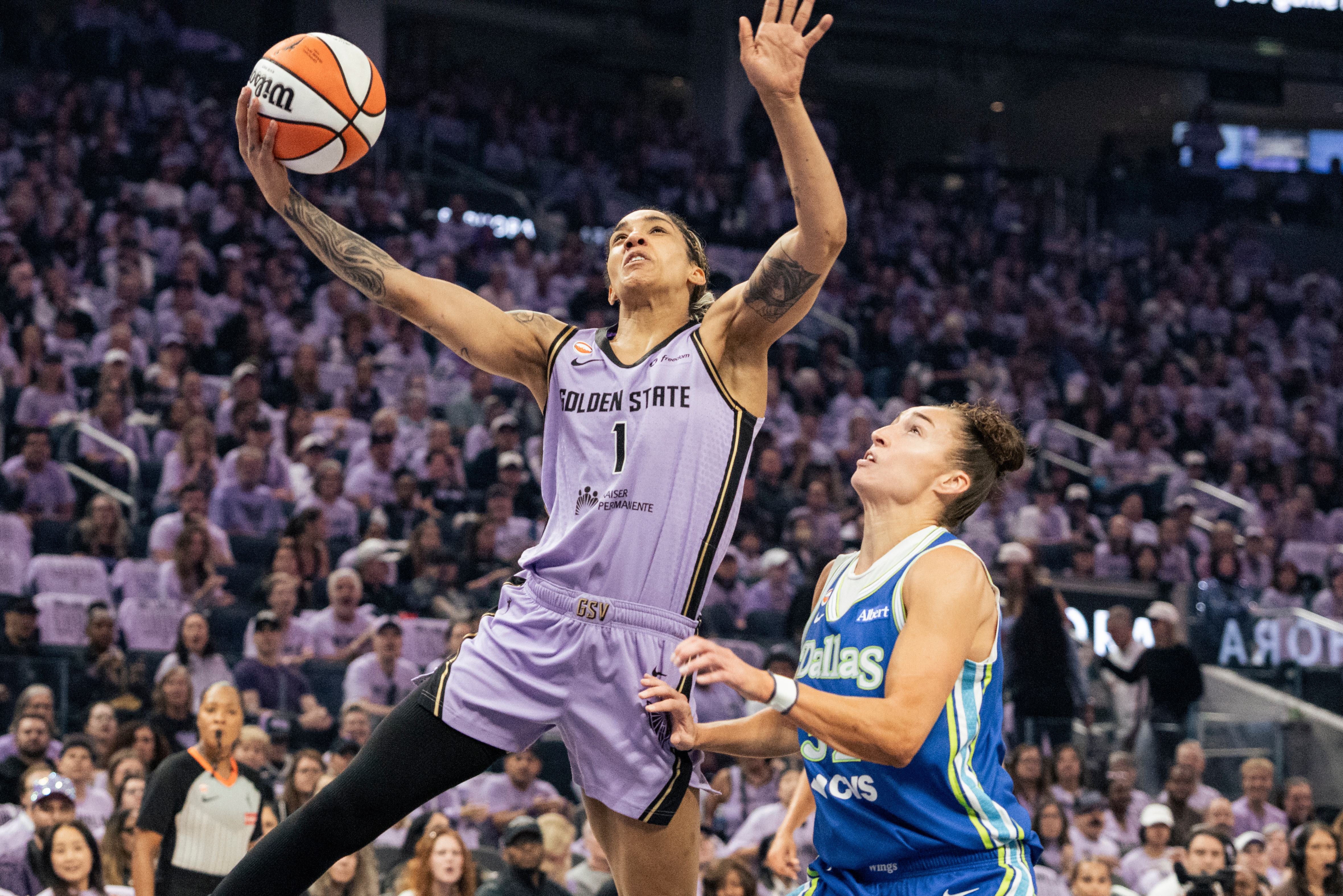 Golden State Valkyries forward Gabby Williams (1) drives for a layup against the Dallas Wings during the first quarter of Game 3 of a WNBA basketball first-round playoff series Friday, Oct. 2, 2026, in San Francisco. 