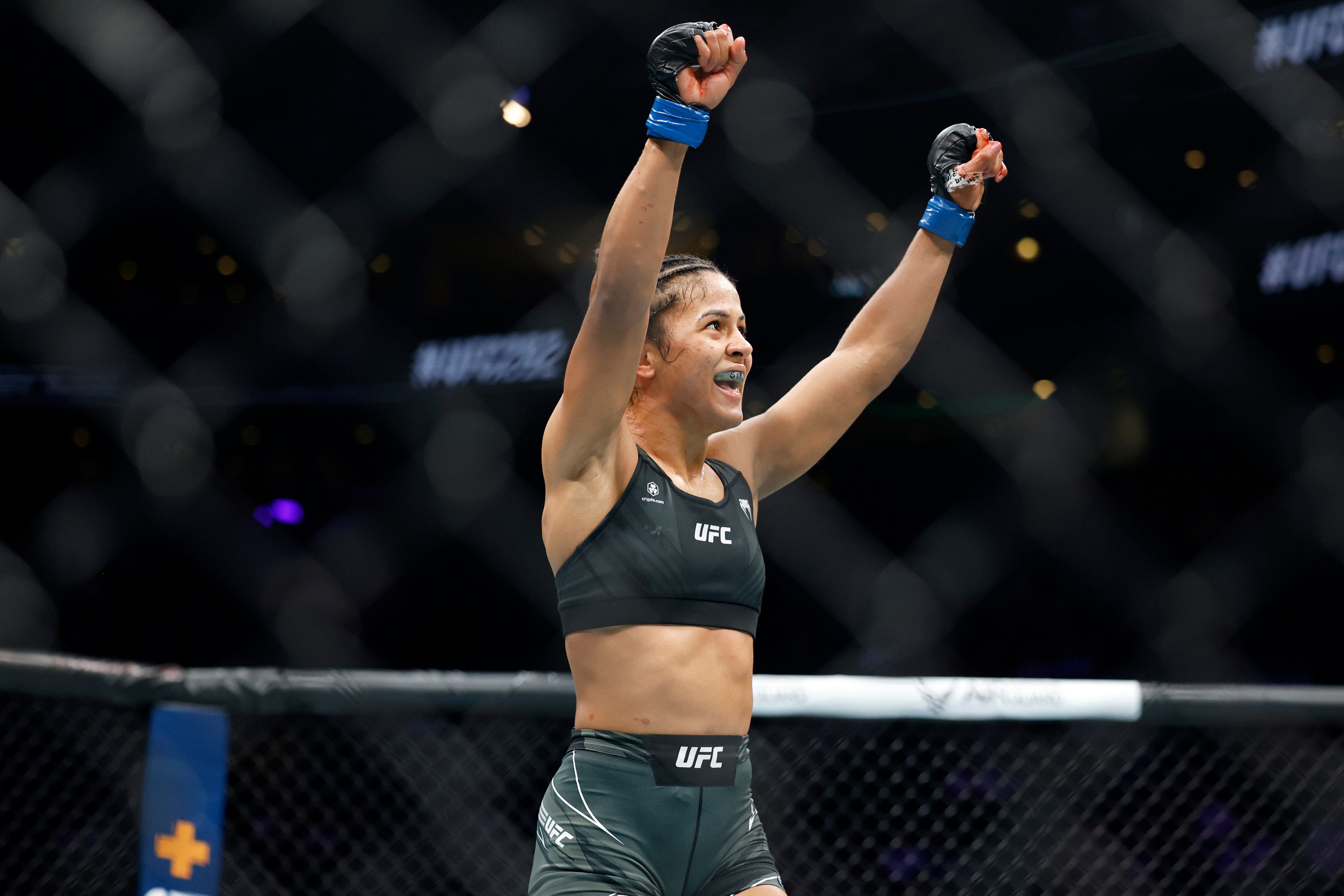Natalia Silva celebrates a win against Andrea Lee during a UFC 292 mixed martial arts fight, Aug. 19, 2023, in Boston. Silva won via unanimous decision.