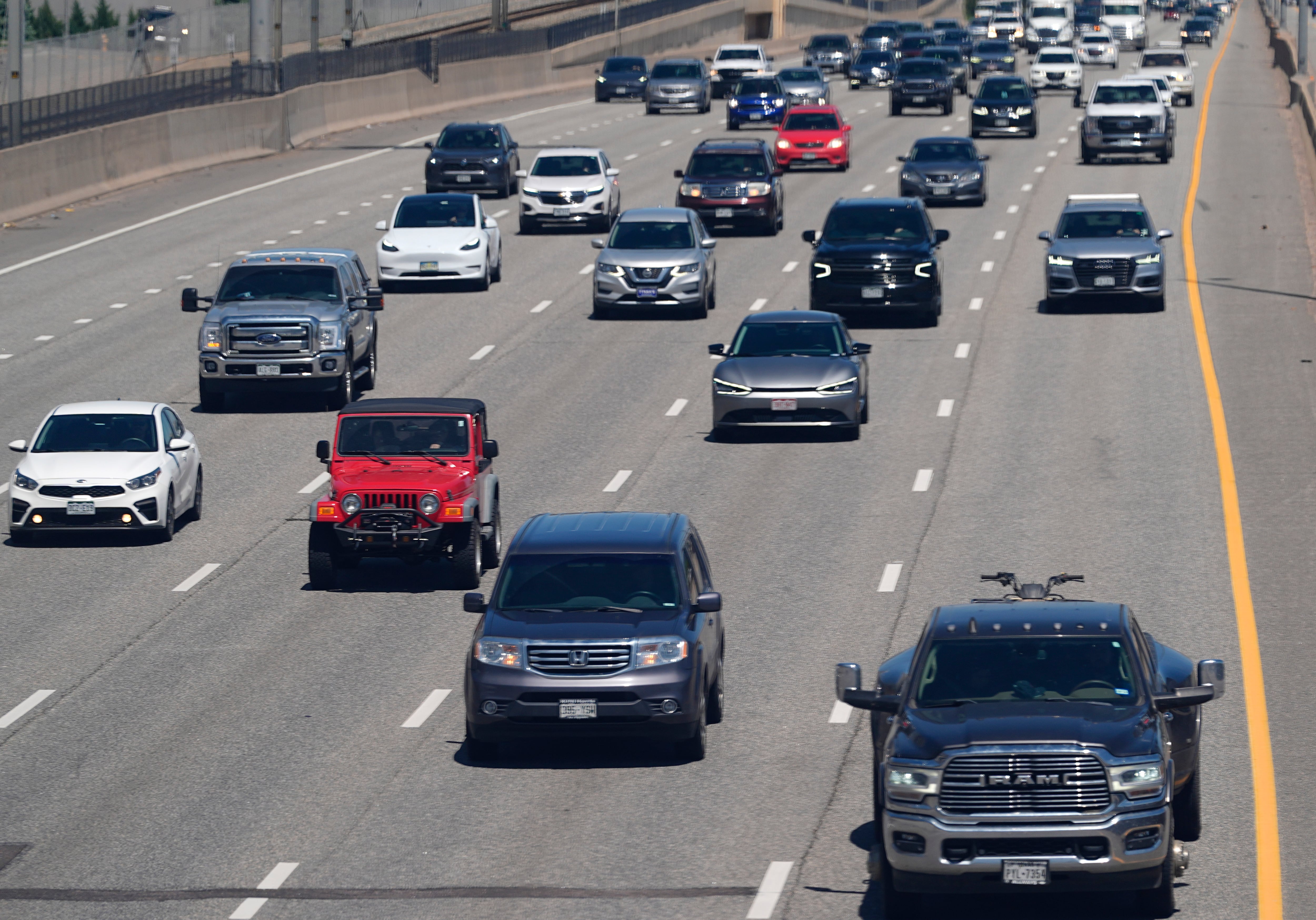 Travelers move through heavy traffic southbound on Interstate 25 near Arapahoe Road as the Memorial Day holiday travel period kicks off  May 23, 2024, in Greenwood Village, Colo.