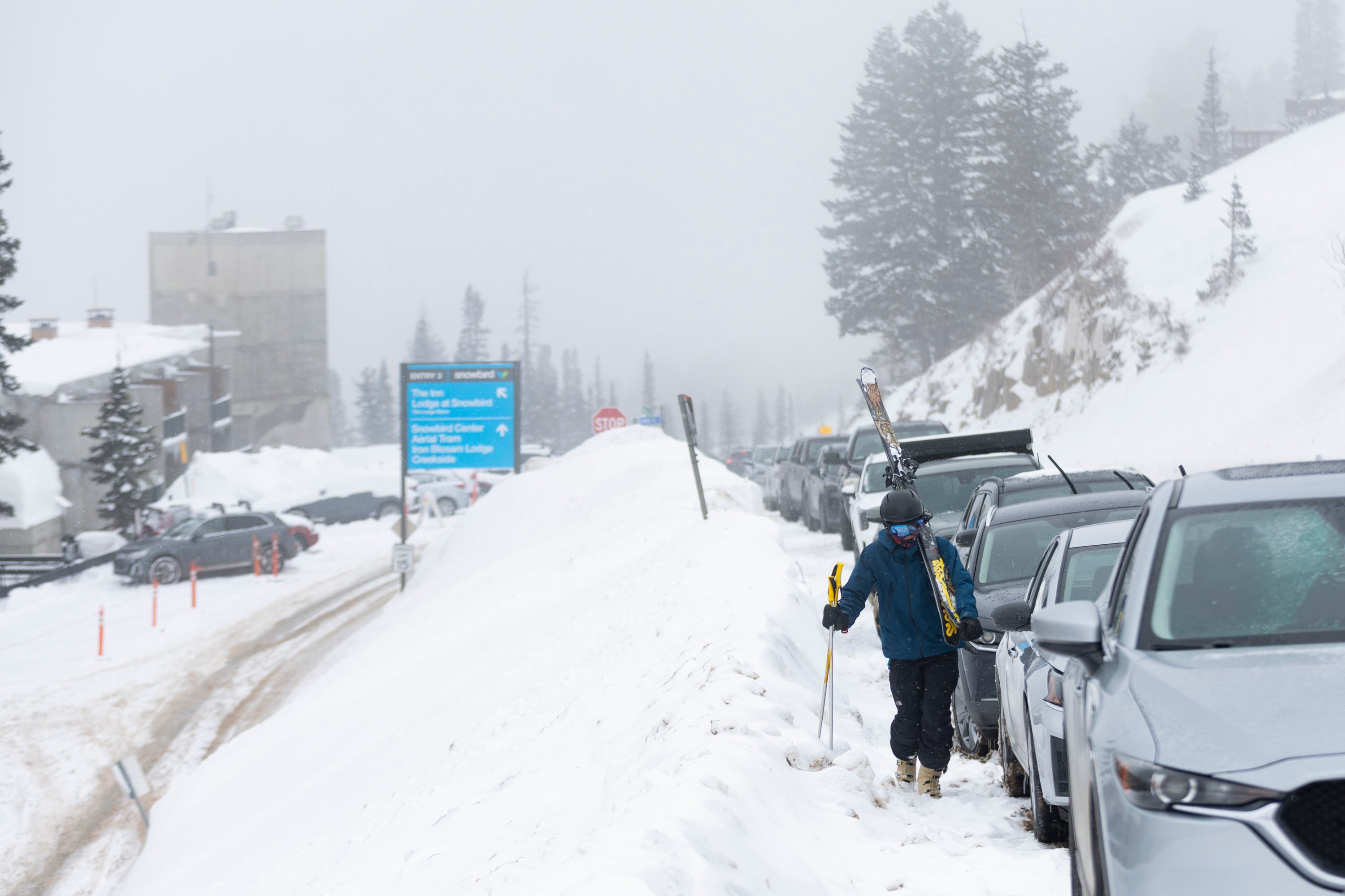 Will Malizia walks up the road to his truck after a day of skiing Snowbird Ski Resort is seen in Little Cottonwood Canyon on March 4, 2024. A super El Nino could be setting up a winter unlike any other.
