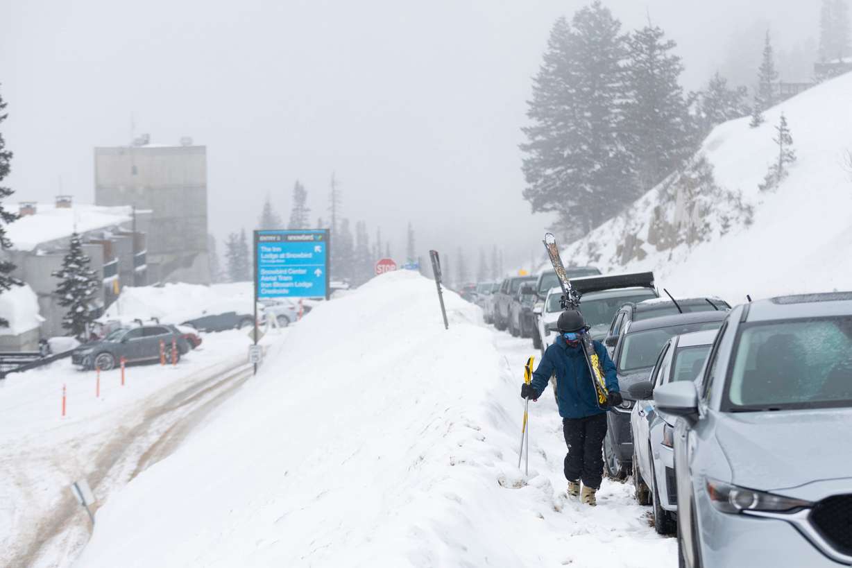 Will Malizia walks up the road to his truck after a day of skiing Snowbird Ski Resort is seen in Little Cottonwood Canyon on March 4, 2024. A super El Nino could be setting up a winter unlike any other.