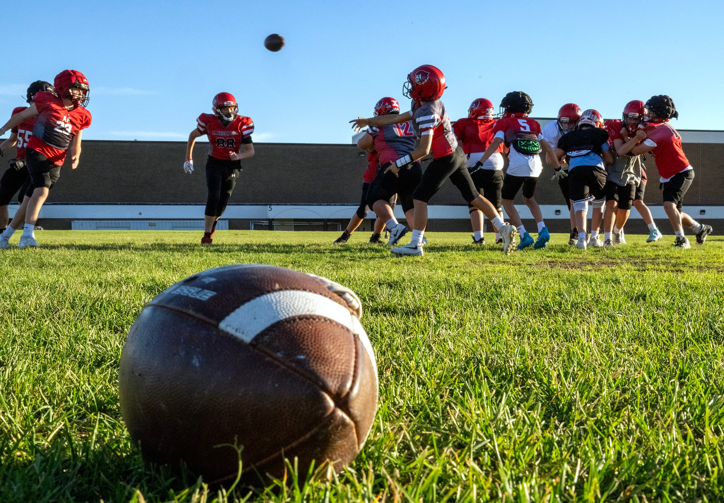 Members of a youth football team in American Fork go through their practice at American Fork Jr. High on Sept. 23. A new poll showed parents are comfortable with kids playing football nationwide — to an extent.