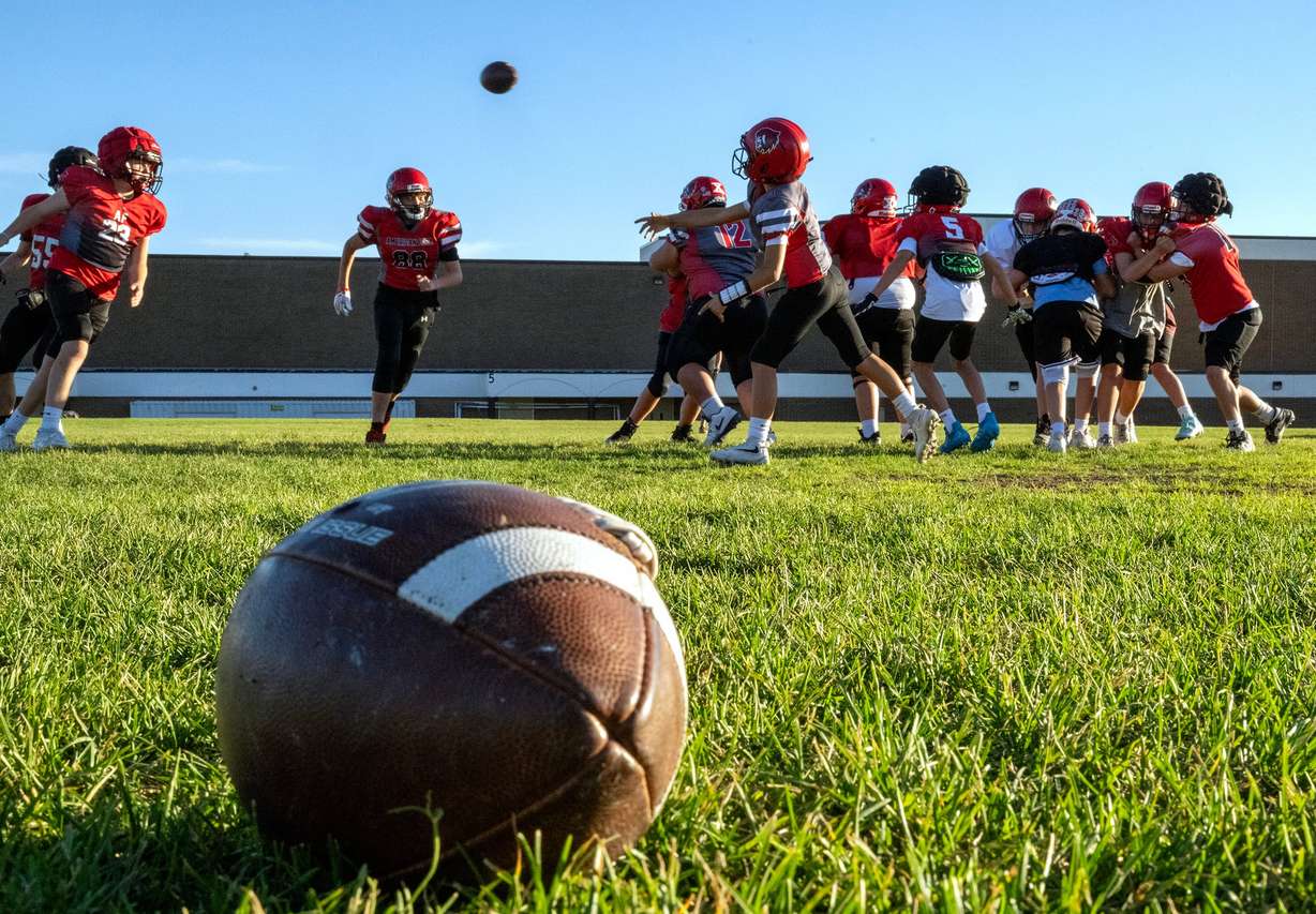 Members of a youth football team in American Fork go through their practice at American Fork Jr. High on Sept. 23. A new poll showed parents are comfortable with kids playing football nationwide — to an extent.