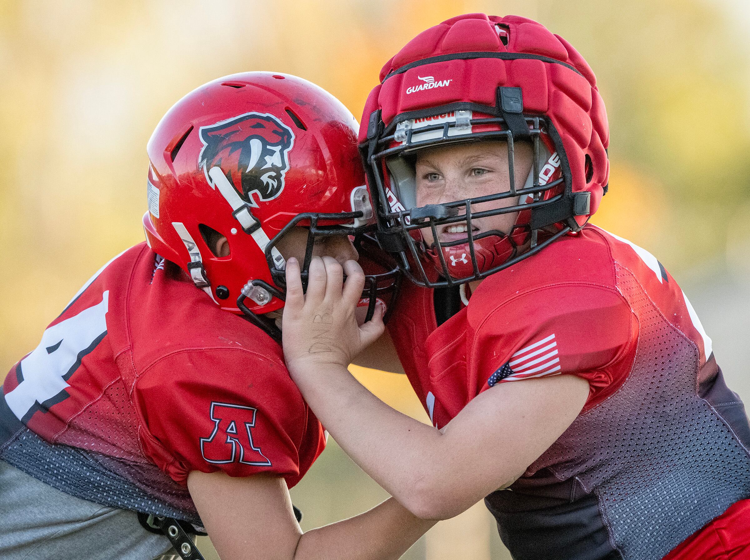 Hagan Clark battles Preston Mack during a play as members of a youth football team in American Fork go through their practice at American Fork Jr. High on on Sept. 23. A new poll showed parents are comfortable with kids playing football nationwide — to an extent.