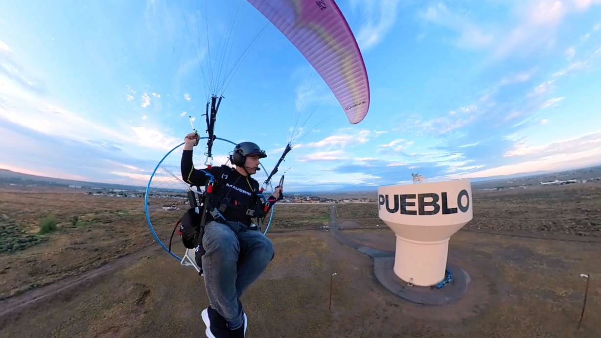Jacob Hutzler flies his paramotor to work as an air traffic controller in Pueblo, Colo., on Aug. 13. Hutzler calls his commute as close as you can get to flying like a bird.