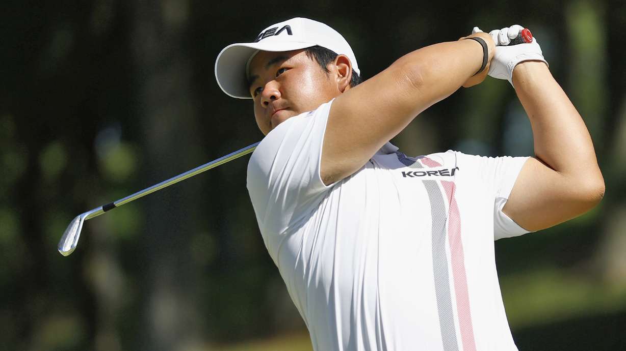South Korea's Tom Kim, also known as Kim Joo-hyung, plays a shot in the men’s singles in golf at the Asian Games in Kasugai, central Japan, Saturday, Oct. 3, 2026.