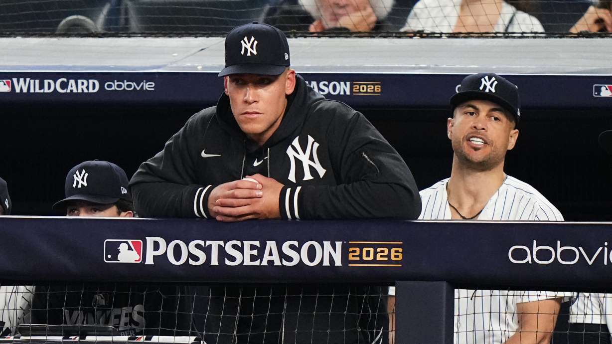 New York Yankees' Aaron Judge, left, and Giancarlo Stanton, right, watch from the dugout during the ninth inning against the Boston Red Sox in Game 2 of baseball's American League Wild Card Series, Wednesday, Sept. 30, 2026, in New York.