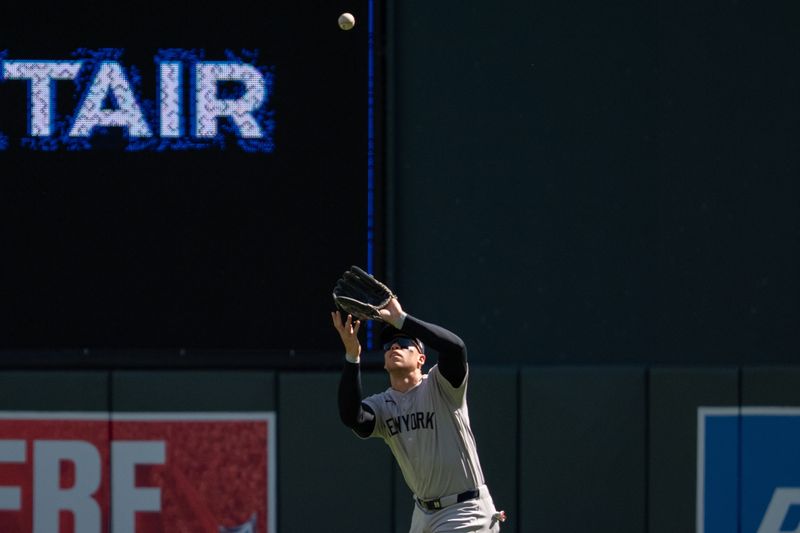 Sep 16, 2026; Minneapolis, Minnesota, USA;  New York Yankees right fielder Aaron Judge (99) retires Minnesota Twins shortstop Ryan Kreidler (5) in the second inning at Target Field.