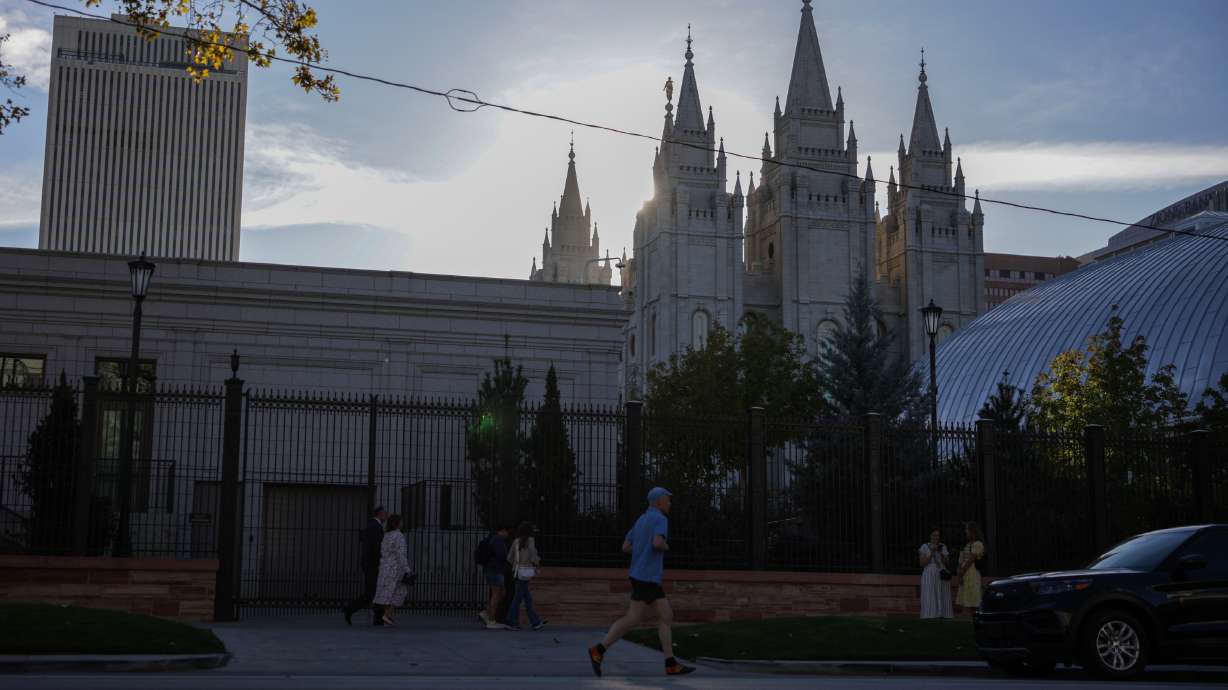 People arrive for the morning session of the 196th Semiannual General Conference of The Church of Jesus Christ of Latter-day Saints, Saturday, in Salt Lake City.