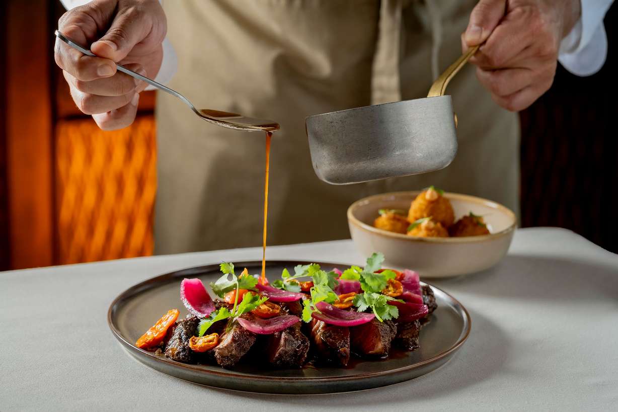 A dish being prepared at Puna in Costa Rica. The Latin American flavors at Puna entice most thanks to acclaimed chef Diego Muñoz and his signature menus.