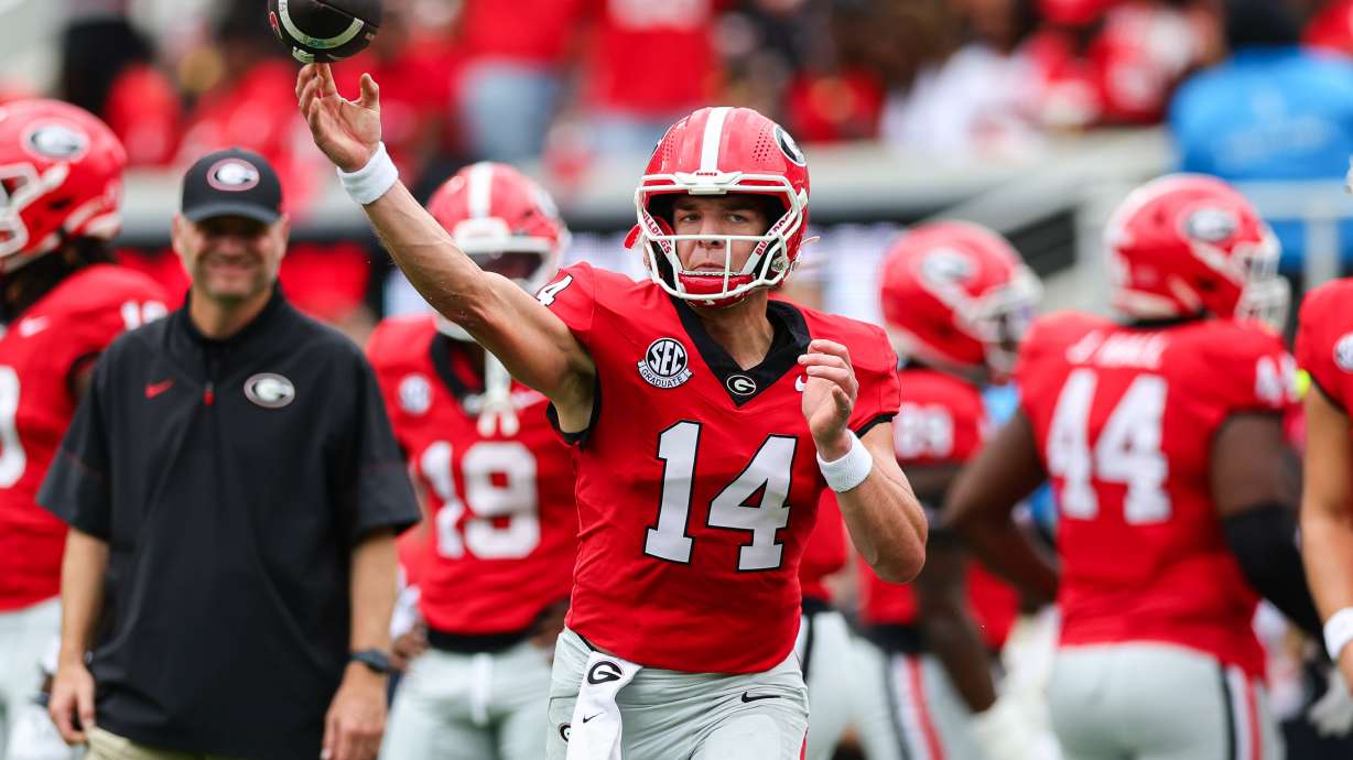 Georgia quarterback Gunner Stockton (14) throws during warm ups before an NCAA college football game against Vanderbilt, Saturday, Oct. 3, 2026, in Athens, Ga.