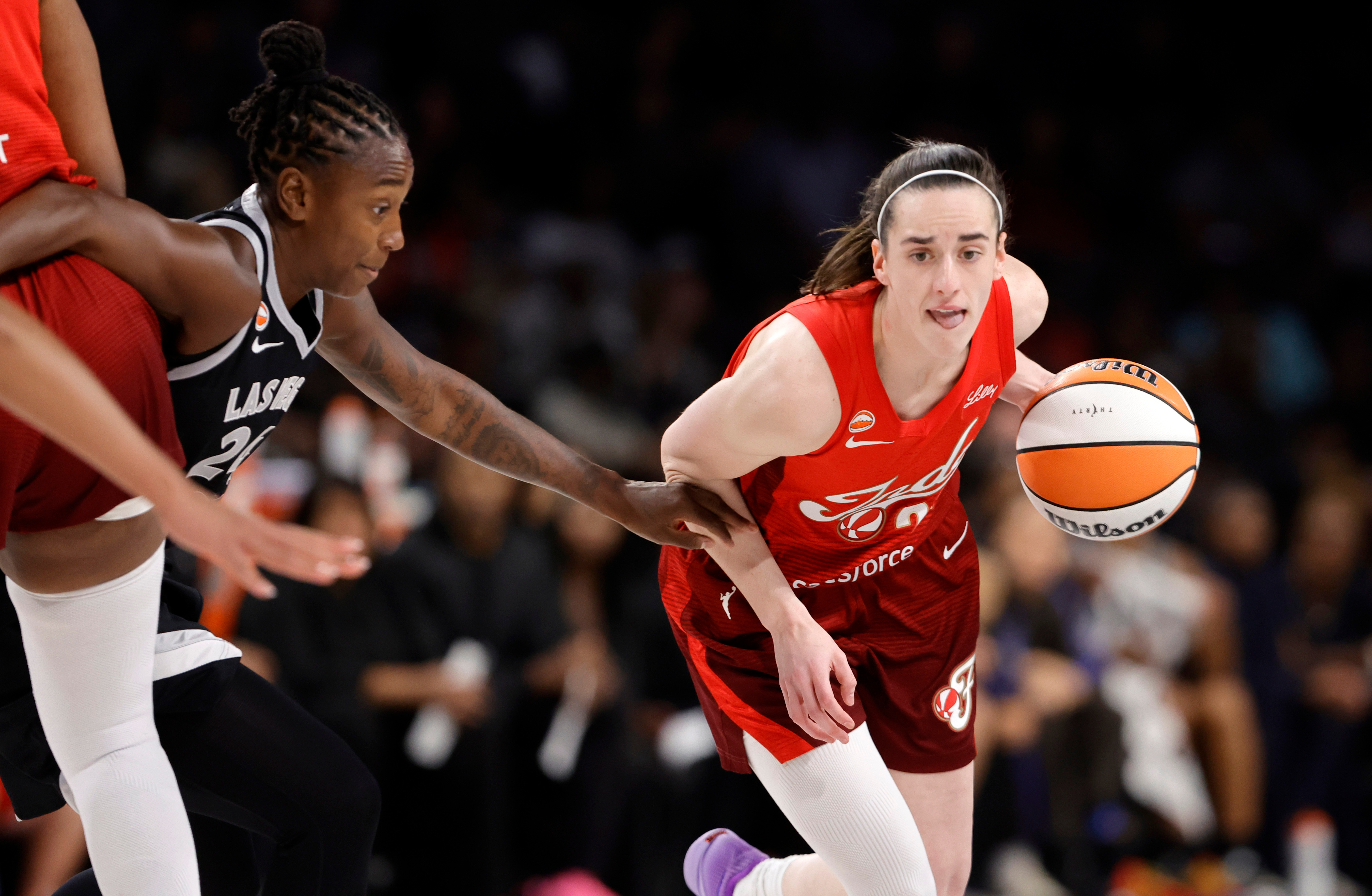 Indiana Fever guard Caitlin Clark (22) drives against Las Vegas Aces guard Jewell Loyd (24) during the first half in Game 3 of an WNBA basketball first-round playoff series Thursday, Oct.1, 2026, in Las Vegas. 