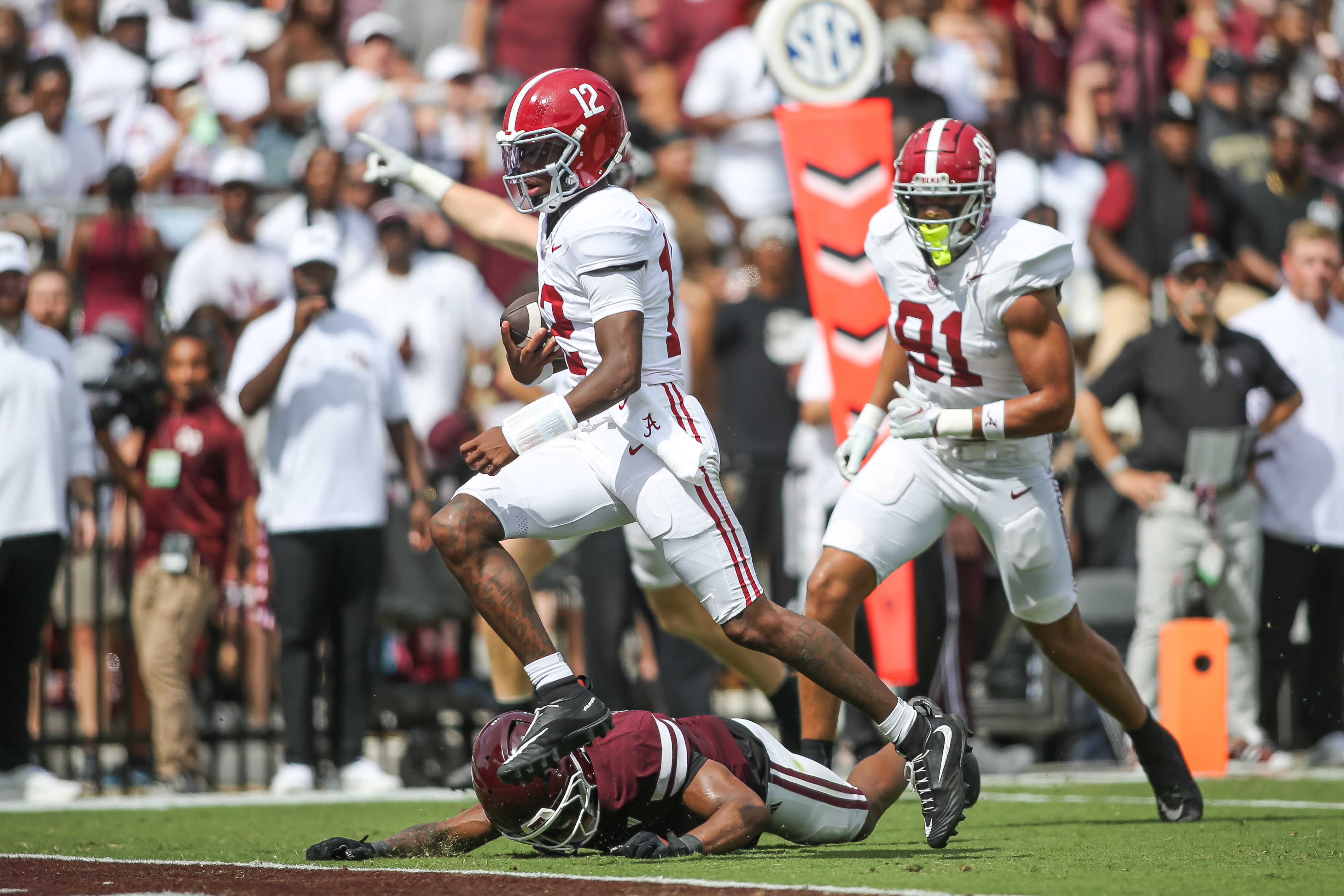 Alabama quarterback Keelon Russell (12) runs for a touchdown against Mississippi State during the first half of an NCAA college football game in Starkville, Miss., Saturday, Oct. 3, 2026. 