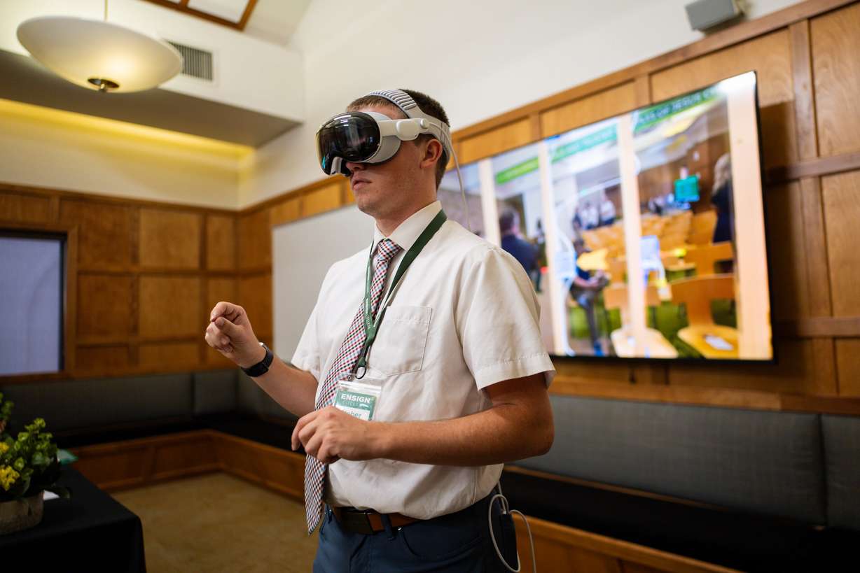 Heber Portlock, first-year student in the electrical program, uses BILT XR software, which allows electricians to see how to do their jobs in any given space, at an Ensign College open house celebrating the opening of its new electrical training program at the Vocational Technical Center in Salt Lake City on Friday.