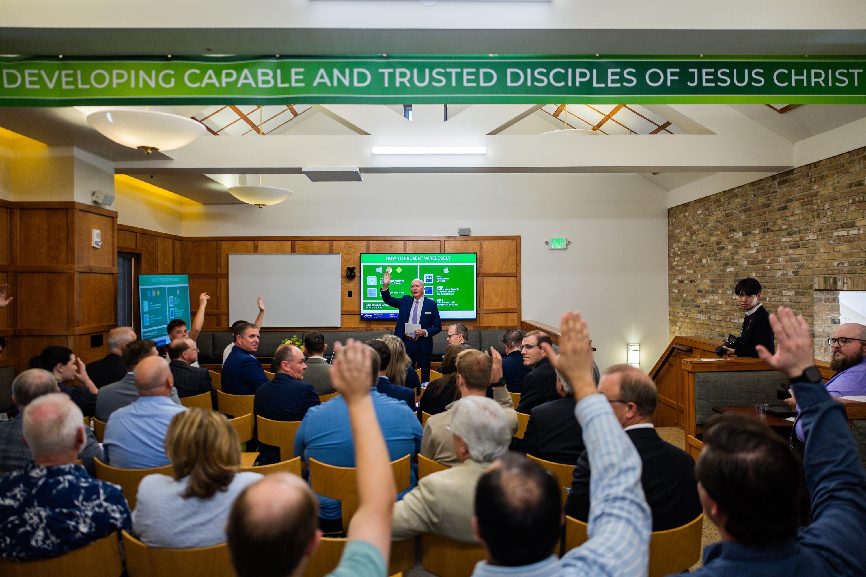 Tim Sloan, vice president of academics at Ensign College, asks students who are a part of the electrical program to raise their hands at an Ensign College open house celebrating the opening of its new electrical training program at the Vocational Technical Center  in Salt Lake City on Friday.