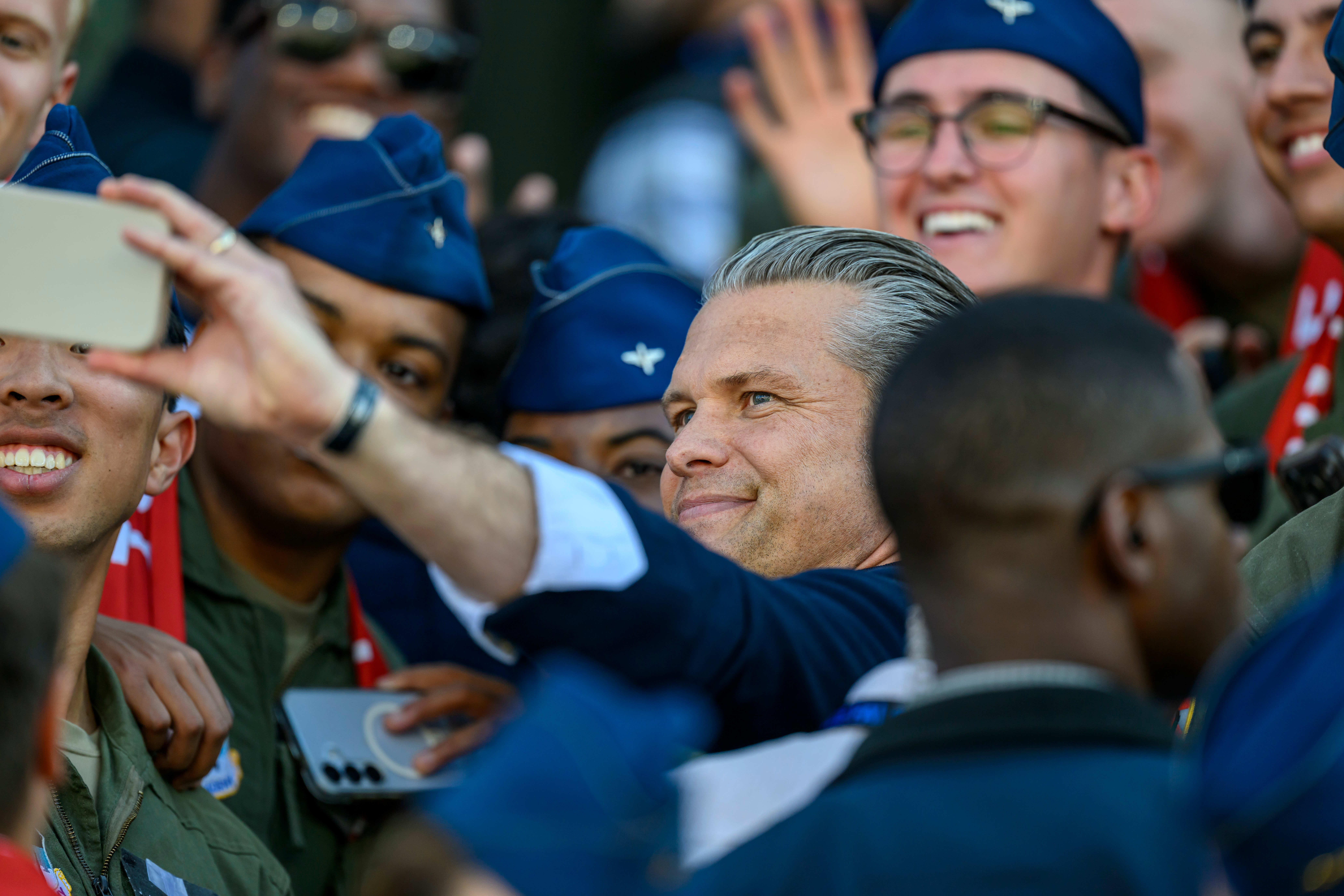 Secretary of War Pete Hegseth takes a selfie with Cadets as he attends an NCAA college football game between Navy and Air Force in Air Force Academy, Colo., Saturday, Oct. 3, 2026. 