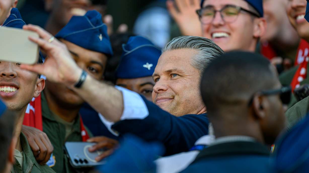 Secretary of War Pete Hegseth takes a selfie with Cadets as he attends an NCAA college football game between Navy and Air Force in Air Force Academy, Colo., Saturday, Oct. 3, 2026.