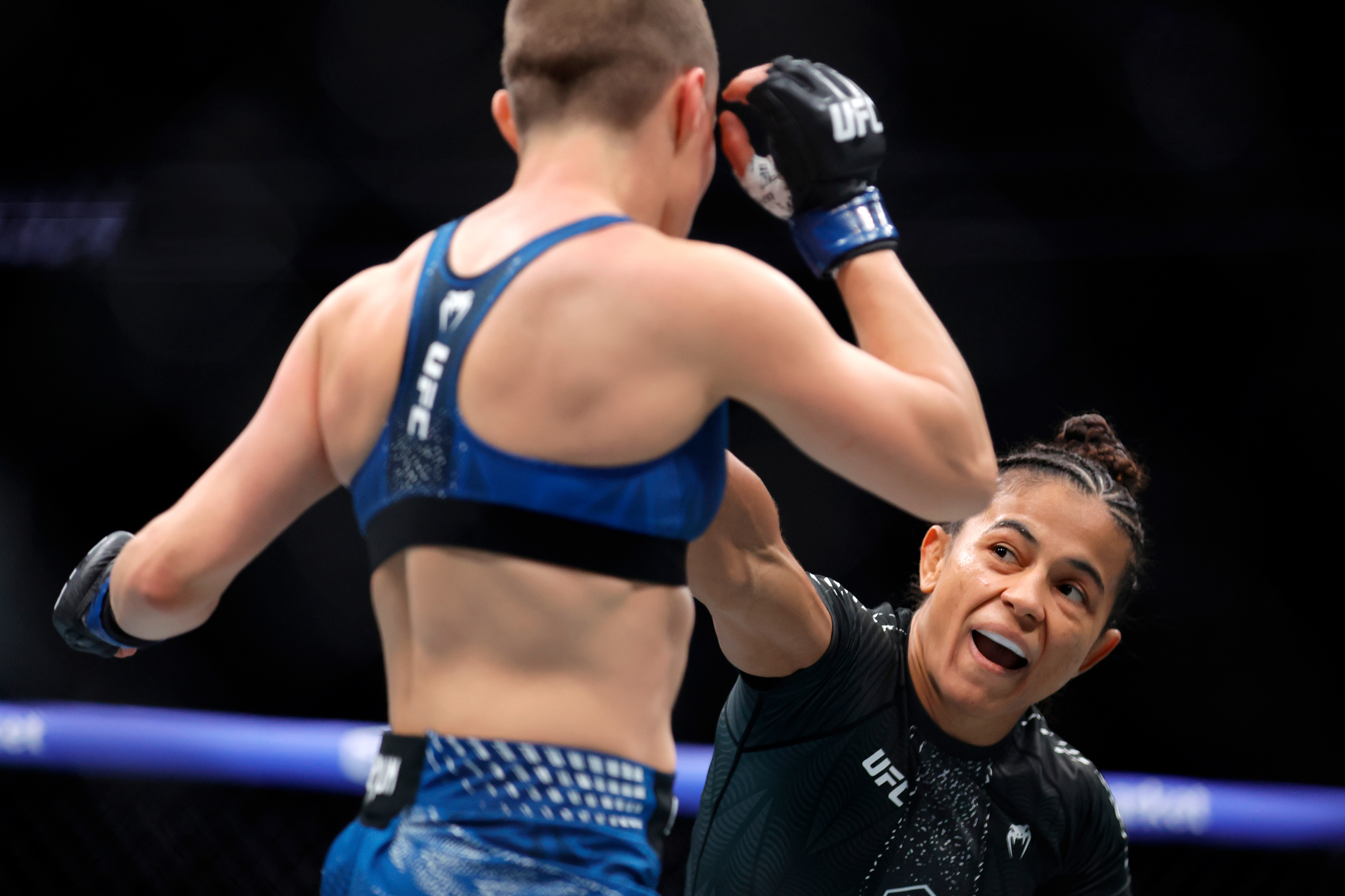 FILE - Natalia Silva, right, punches Rose Namajunas in a women's flyweight bout during the UFC 324 mixed martial arts event Saturday Jan. 24, 2026, in Las Vegas. 