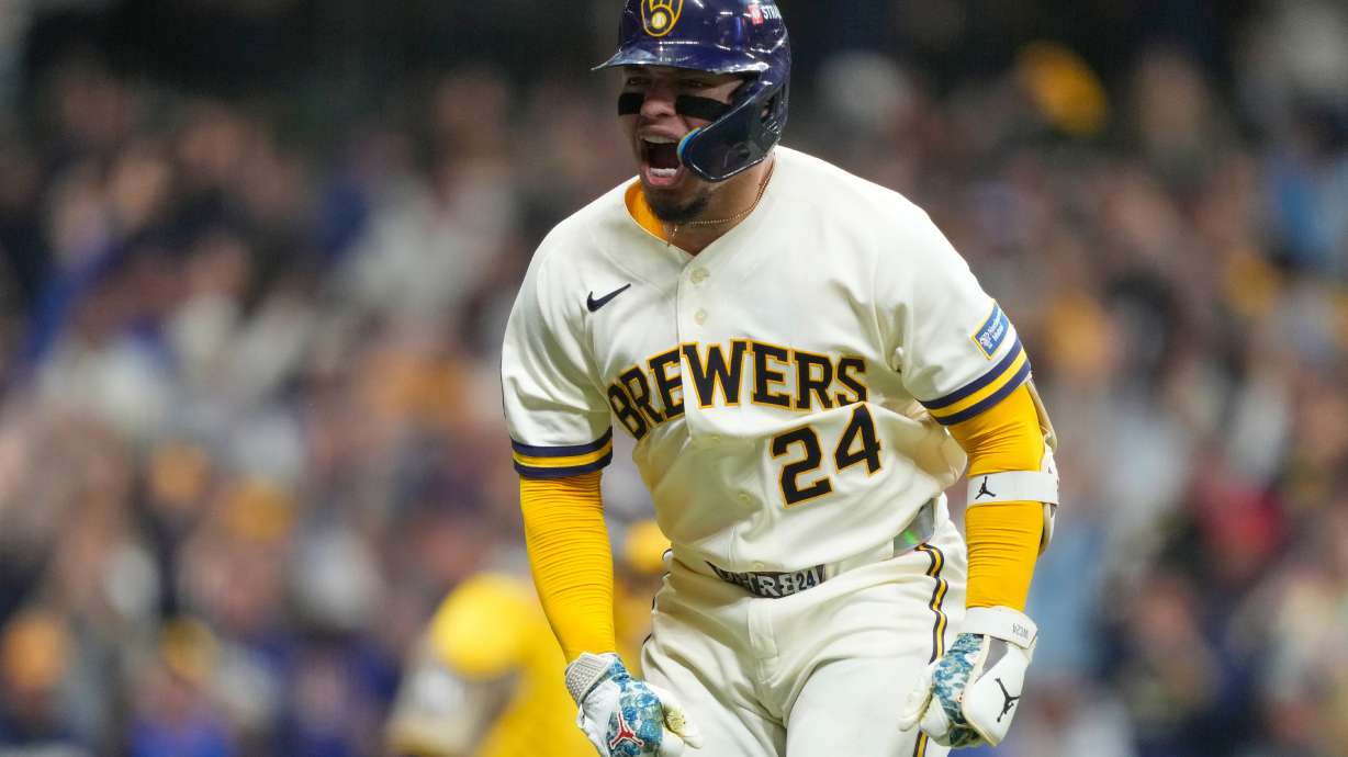 Milwaukee Brewers' William Contreras reacts after hitting a home run during the seventh inning in Game 1 of a National League Divisional baseball playoff series against the San Diego Padres Saturday, Oct. 3, 2026, in Milwaukee.
