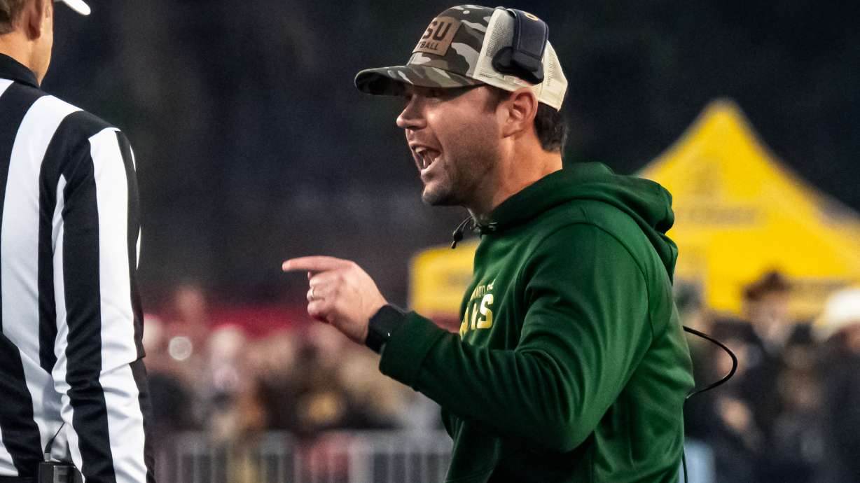 FILE - Colorado State interim head coach Tyson Summers speaks to the officials during an NCAA college football game against Wyoming on Saturday, Oct. 25, 2025, in Laramie, Wyo. /The Wyoming Tribune Eagle via AP, File)