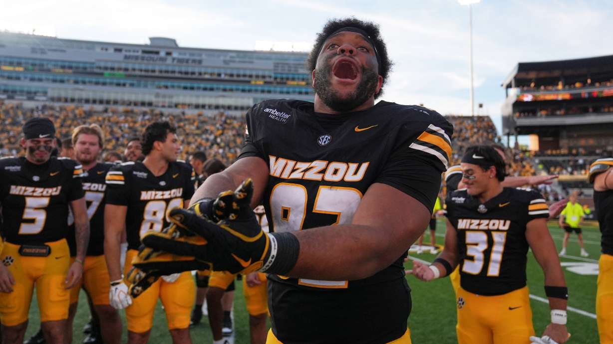 Missouri defensive tackle Jason Dowell celebrates a victory over Florida with his teammates following an NCAA college football game Saturday, Oct. 3, 2026, in Columbia, Mo.