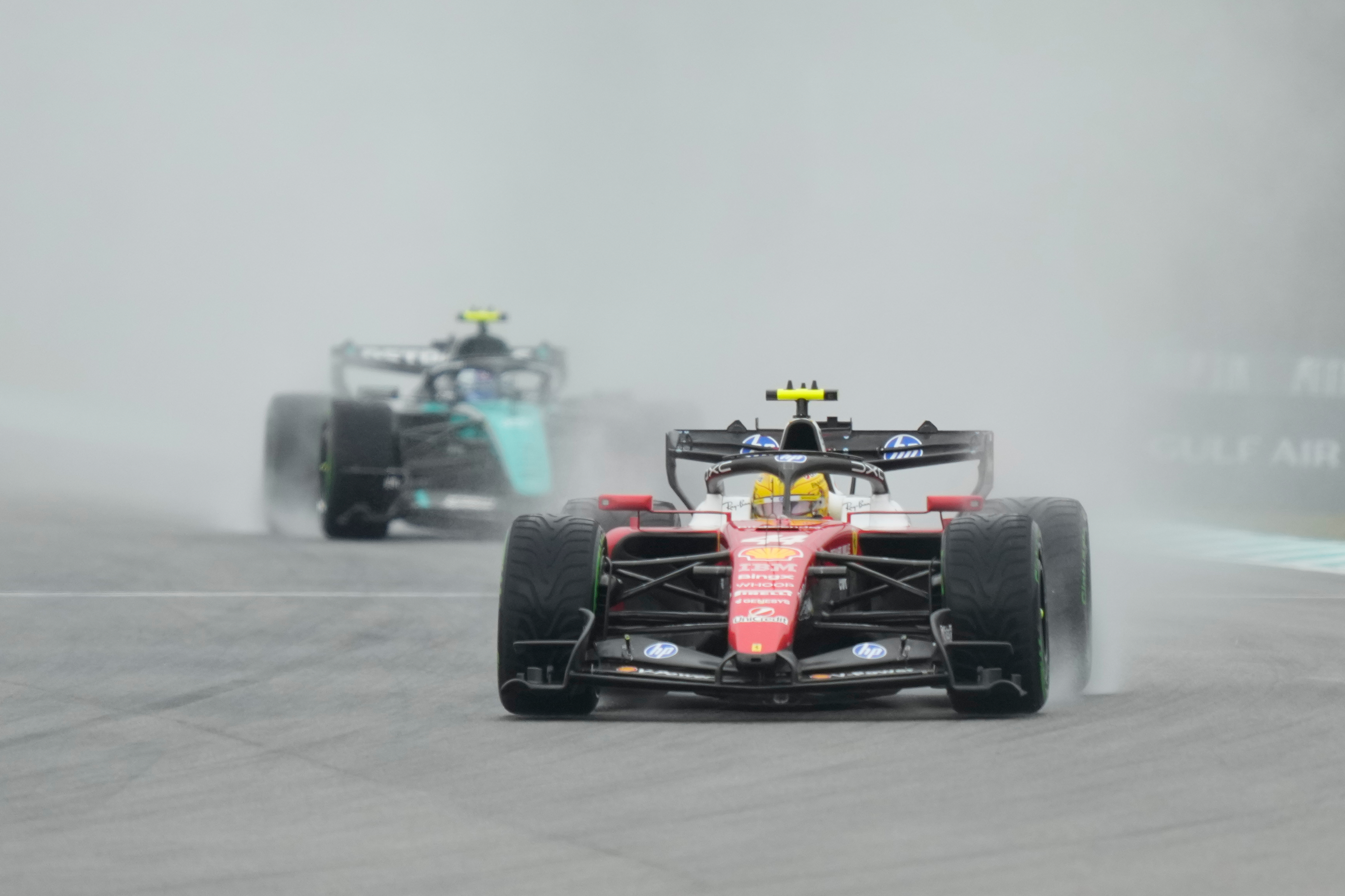 Ferrari driver Lewis Hamilton of Britain steers his car during the formation lap prior to the delayed start of the Bahrain Grand Prix in Sepang, Malaysia, Sunday, Oct. 4, 2026. 