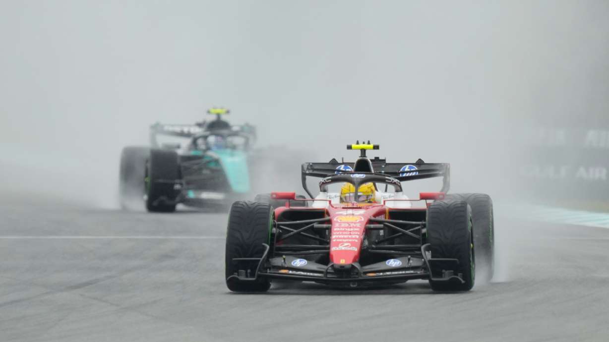 Ferrari driver Lewis Hamilton of Britain steers his car during the formation lap prior to the delayed start of the Bahrain Grand Prix in Sepang, Malaysia, Sunday, Oct. 4, 2026.