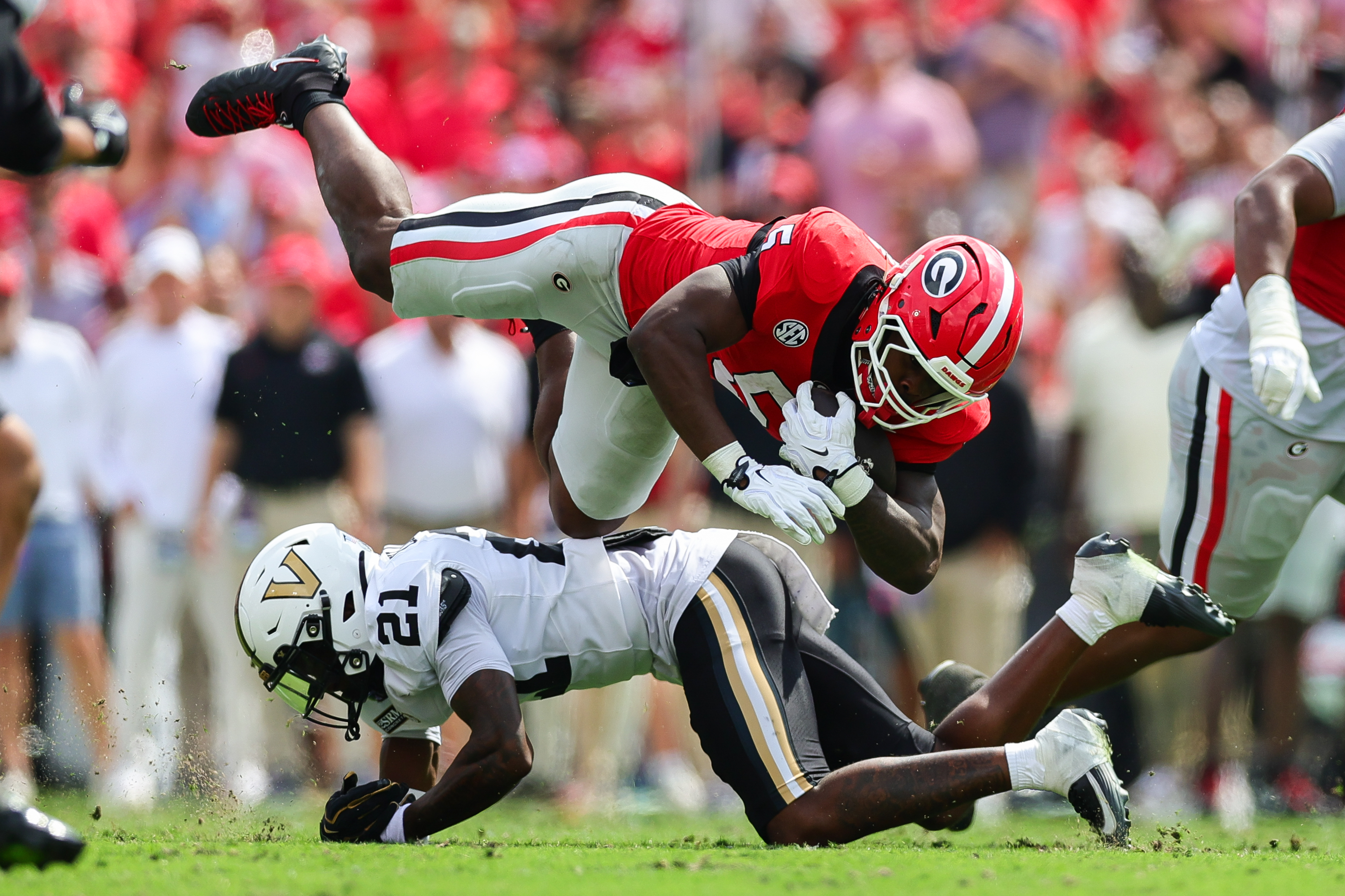 Vanderbilt safety Davin Chandler (21) tackles Georgia running back Chauncey Bowens (5) during the first half of an NCAA college football game, Saturday, Oct. 3, 2026, in Athens, Ga. 