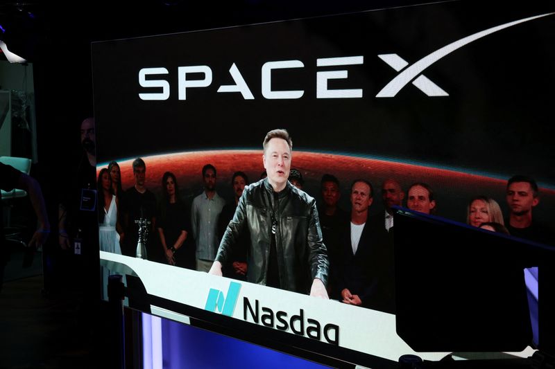 Founder, CEO, Chairman, and Chief Engineer of SpaceX, Elon Musk, speaks via videolink on the day of SpaceX's initial public offering (IPO) at the Nasdaq MarketSite in New York City, June 12.