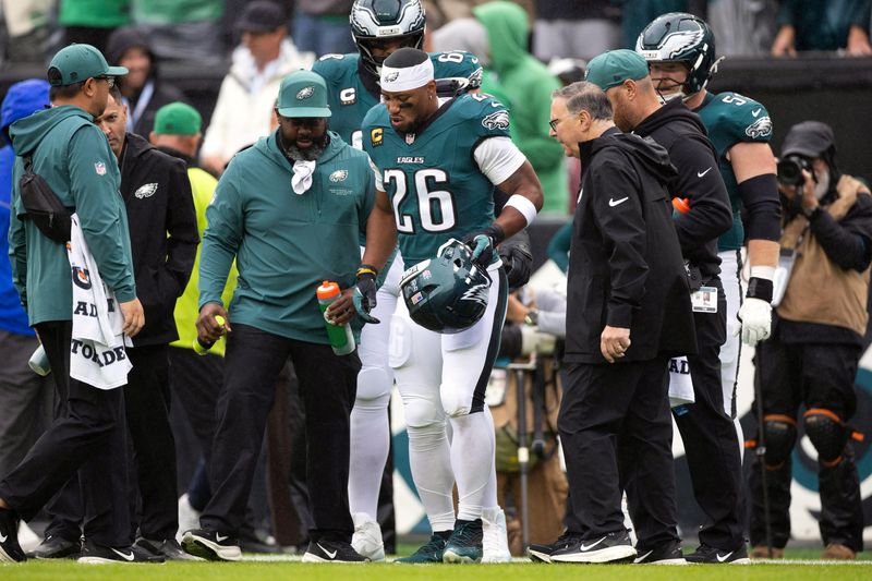 Oct 4, 2026; Philadelphia, Pennsylvania, USA;  Philadelphia Eagles running back Saquon Barkley (26) walks off the field with an apparent injury against the Los Angeles Rams during the first quarter at Lincoln Financial Field.
