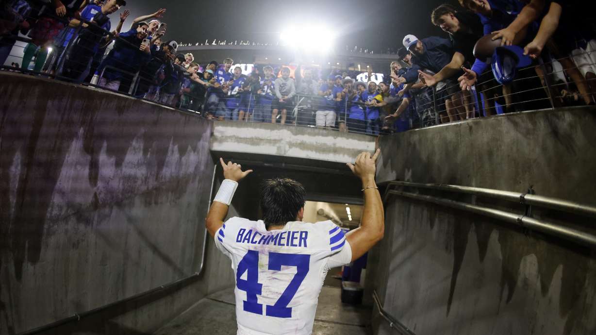 Bear Bachmeier #47 of the BYU Cougars celebrates with fans following the team's win over the TCU Horned Frogs at Amon G. Carter Stadium on October 3, 2026 in Fort Worth, Texas.
