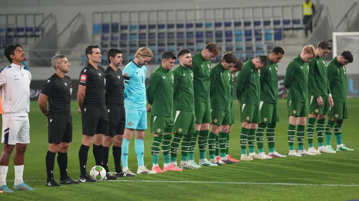 Irish players bow their heads during Israeli national anthem before the UEFA Nations League soccer match between the Republic of Ireland and Israel in Backa Topola, Serbia, Sunday, Oct. 4, 2026.