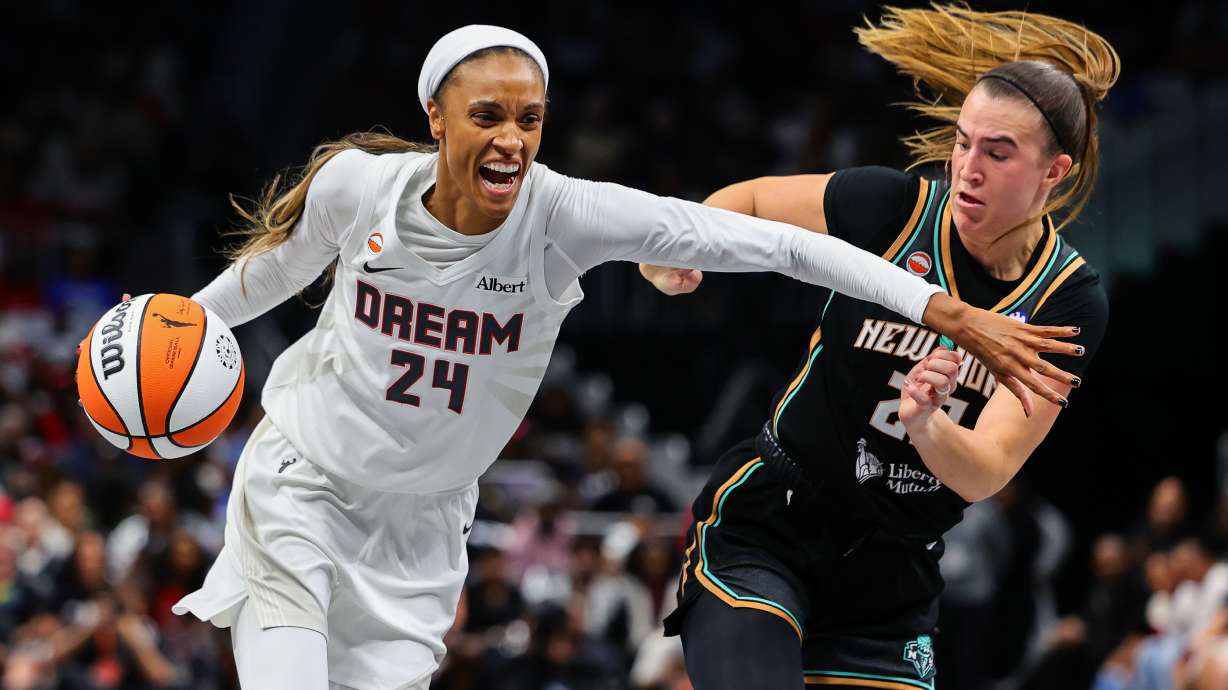 Atlanta Dream forward DeWanna Bonner (24) drives to the basket against New York Liberty guard Sabrina Ionescu, right, during the first half of Game 1 of the WNBA basketball semifinals Sunday, Oct. 4, 2026, in Atlanta.