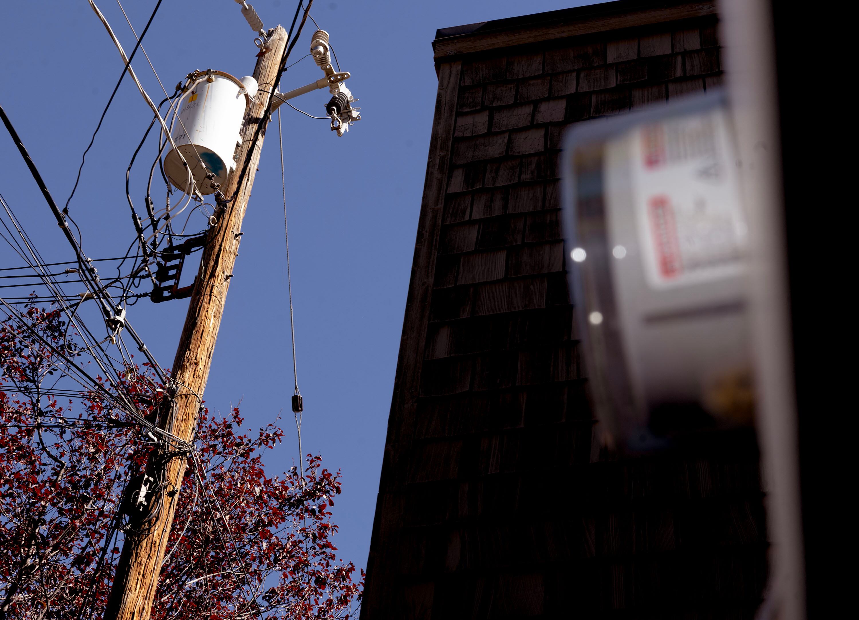 A home’s energy usage is tracked on a meter socket  in Salt Lake City on Sept. 30.