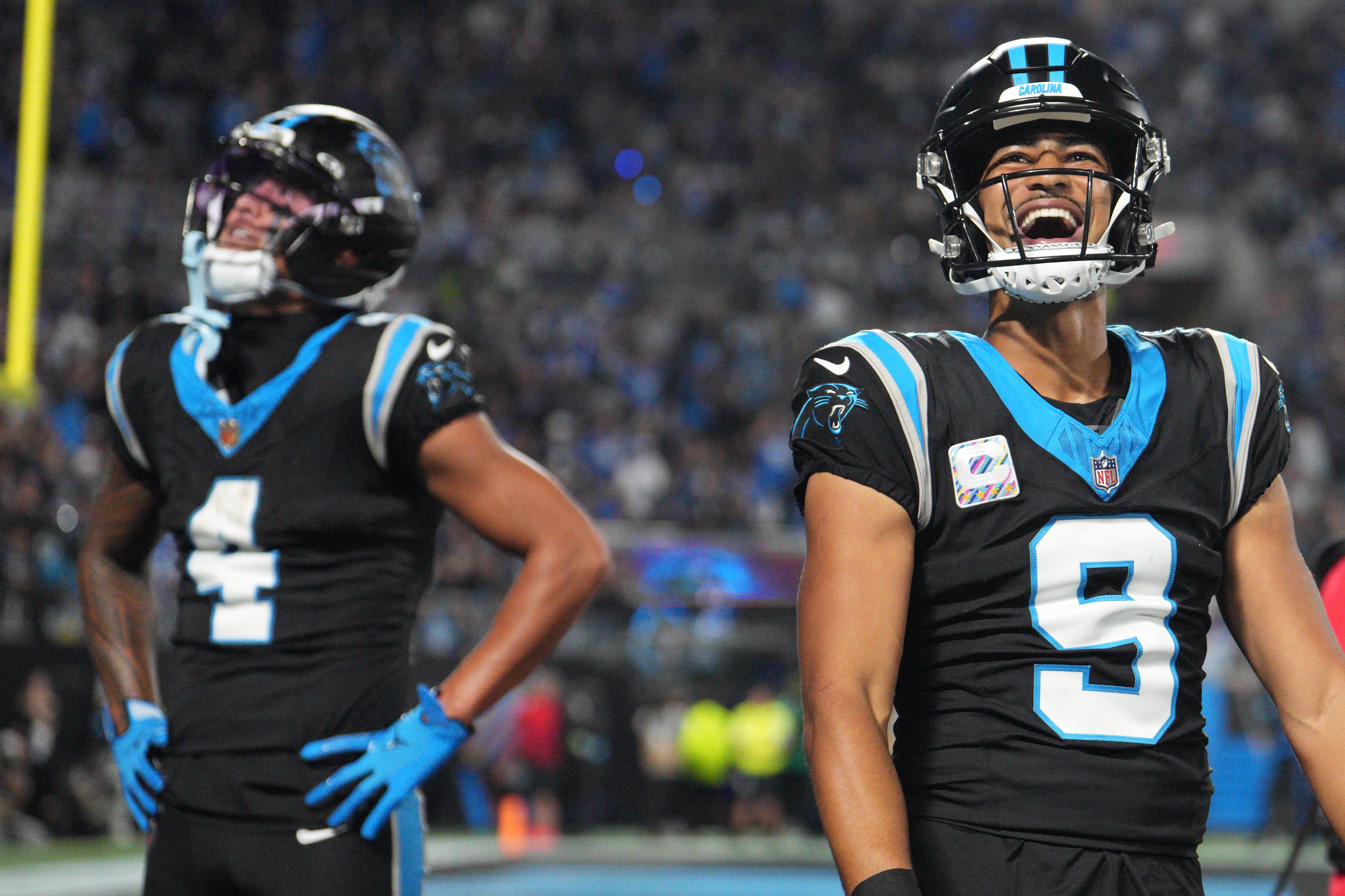 Carolina Panthers quarterback Bryce Young (9) celebrates after Carolina Panthers wide receiver Tetairoa McMillan (4) scores a touchdown during an NFL football game against the Detroit Lions in Charlotte, N.C., Sunday, Oct. 4, 2026. 