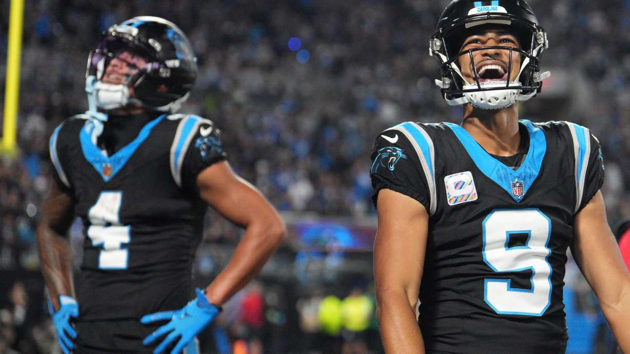 Carolina Panthers quarterback Bryce Young (9) celebrates after Carolina Panthers wide receiver Tetairoa McMillan (4) scores a touchdown during an NFL football game against the Detroit Lions in Charlotte, N.C., Sunday, Oct. 4, 2026.