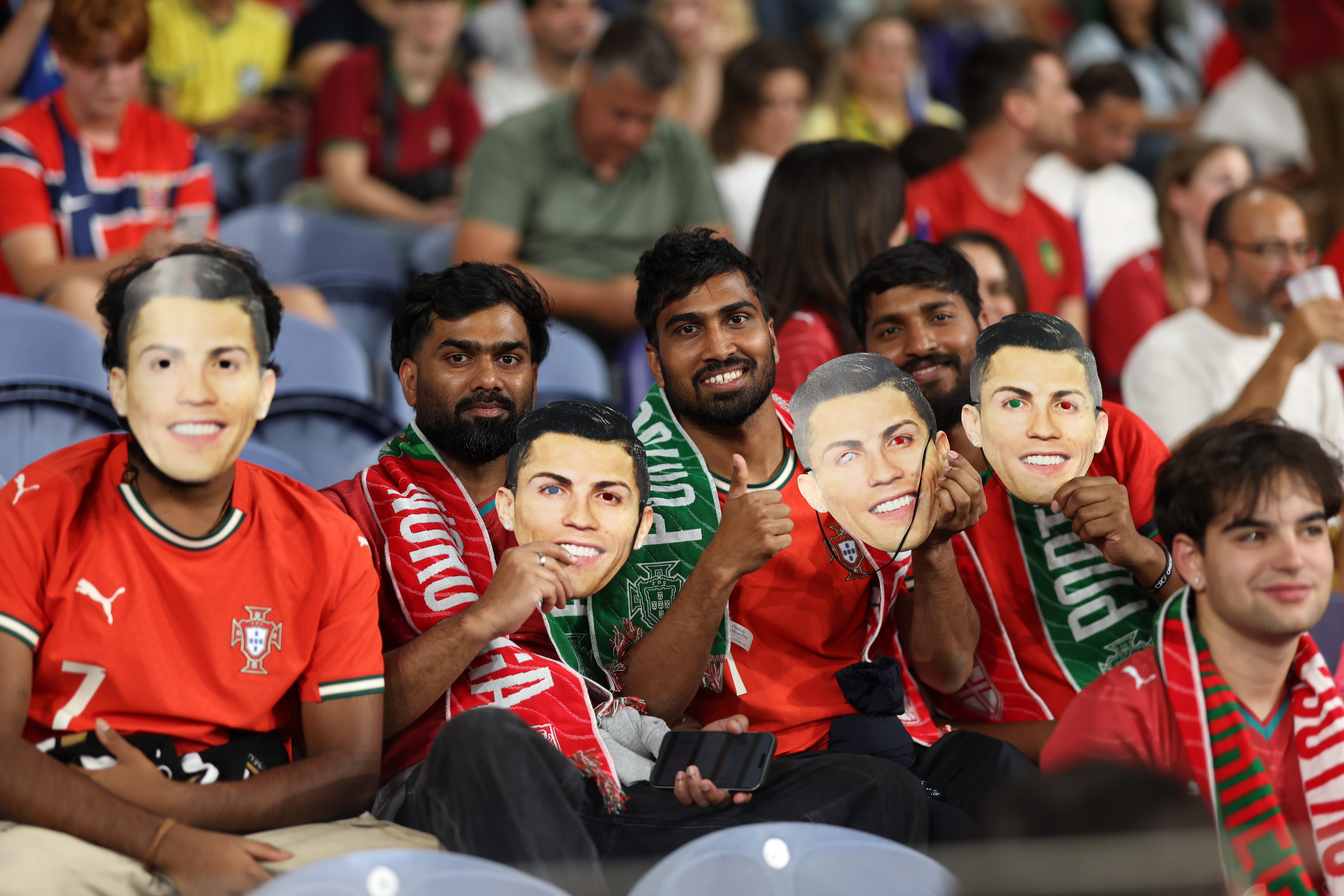 Fans on the stands holds masks of Portugal's Cristiano Ronaldo during the Nations League soccer match between Portugal and Norway in Porto, Portugal, Sunday, Oct. 4, 2026. 