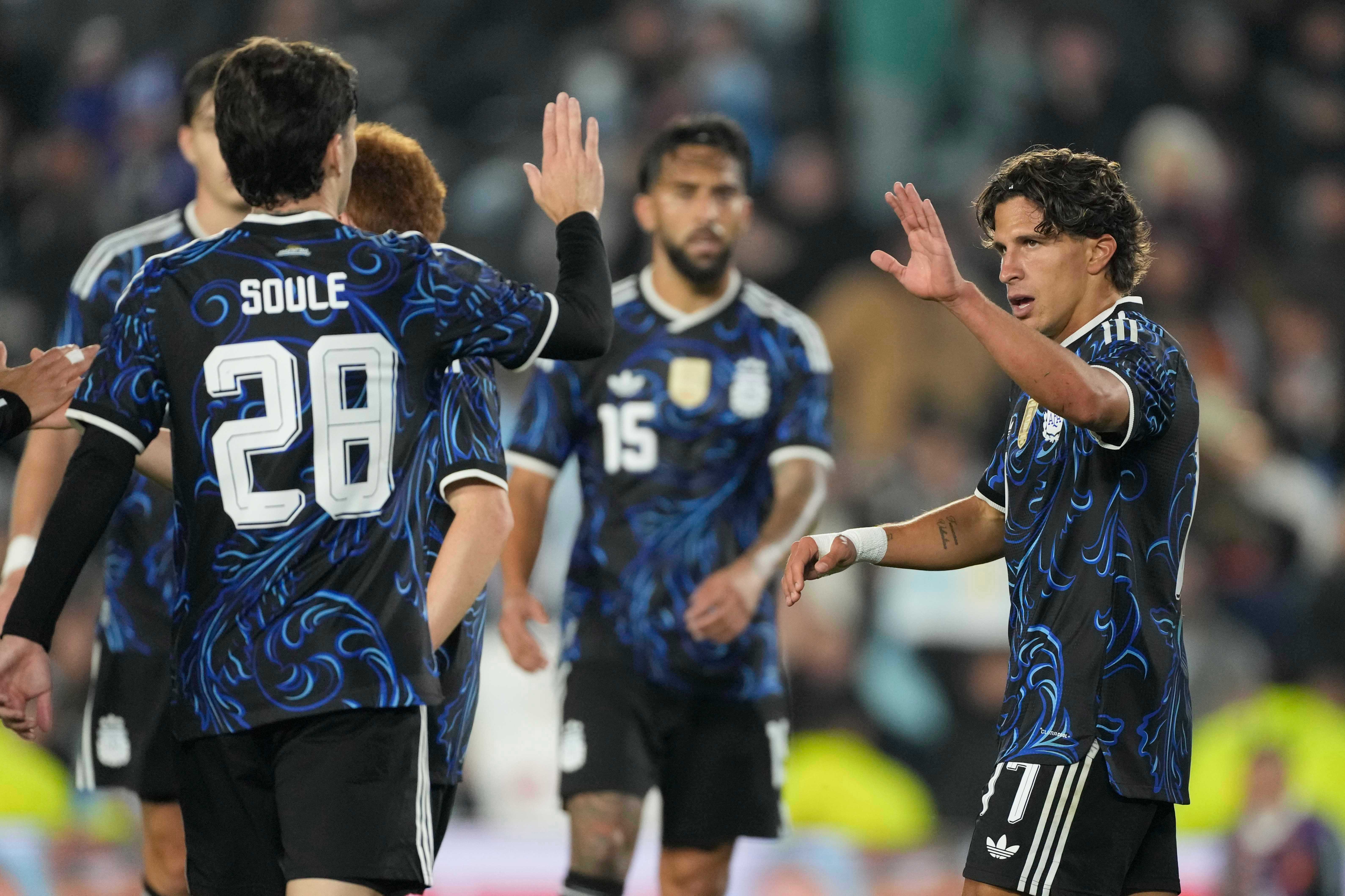 Argentina's Giuliano Simeone, right, celebrates with teammates after scoring his side's seventh goal against Burkina Faso during an international friendly soccer match in Buenos Aires, Argentina, Saturday, Oct. 3, 2026. 