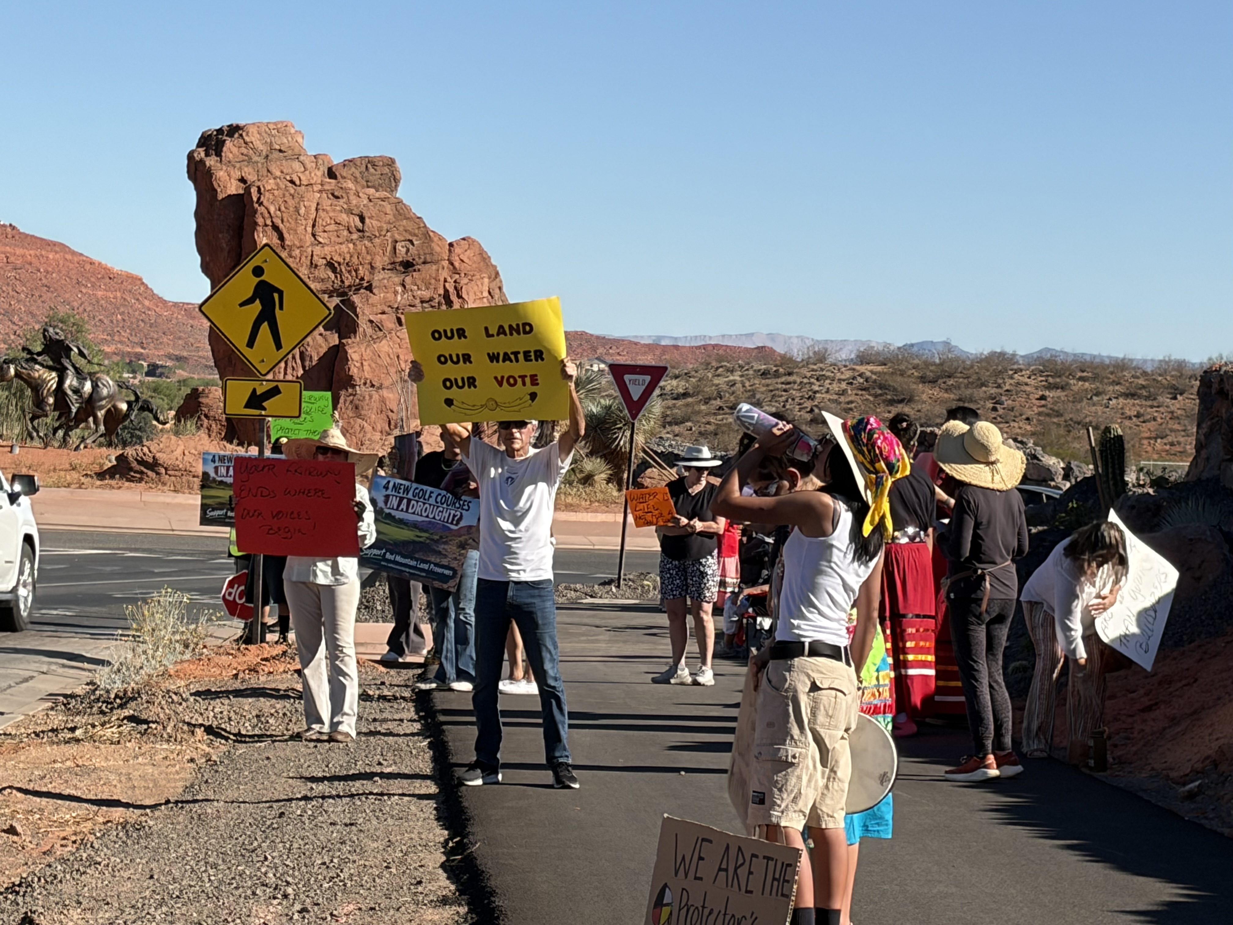 Nearly 60 members and supporters of the Shivwits Band of Paiute Native American Tribe stood Saturday in protest of a golf resort projected to be built on tribal land.