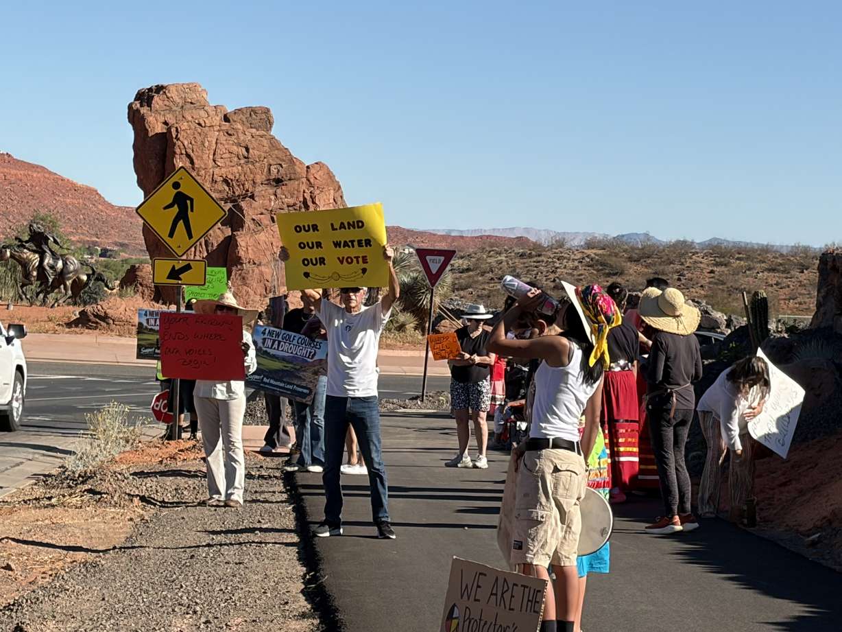 Nearly 60 members and supporters of the Shivwits Band of Paiute Native American Tribe stood Saturday in protest of a golf resort projected to be built on tribal land.