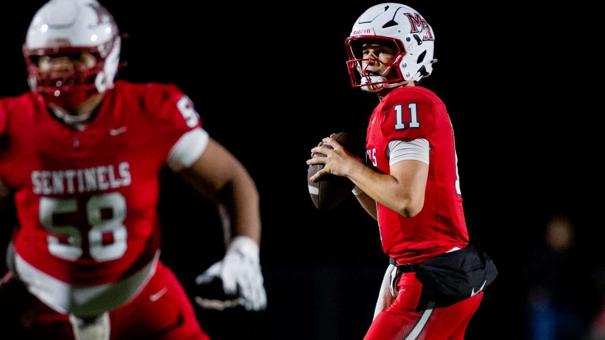 Mountain Ridge Sentinels quarterback Jaxon Hunt (11) prepares to throw the ball during a 6A high school football game against the Skyridge Falcons at Mountain Ridge High School in Herriman on Thursday, Aug. 13, 2026.