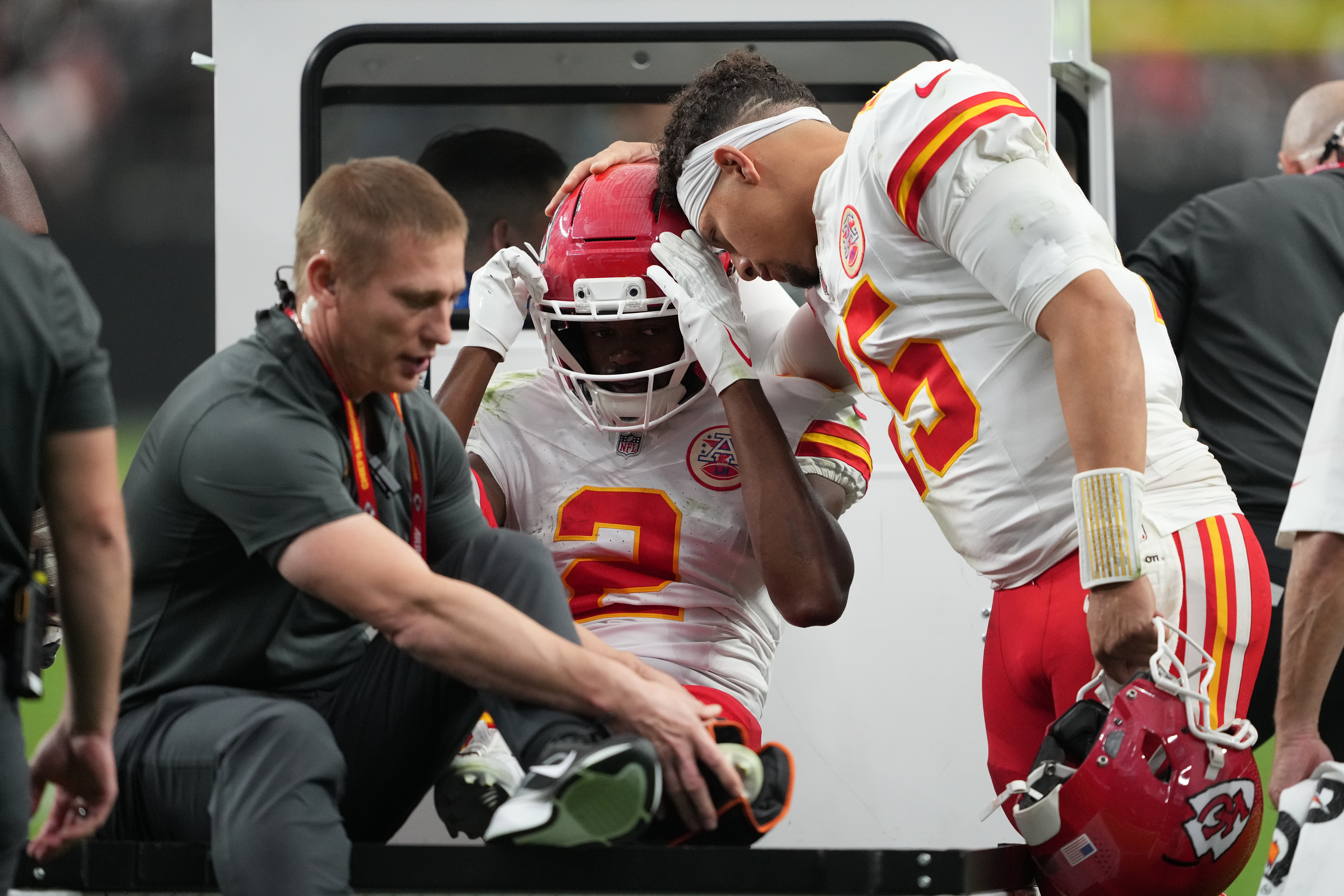Kansas City Chiefs quarterback Patrick Mahomes (15) talks with wide receiver Tyquan Thornton (2) as he is carted off the field with an injury during the second half of an NFL football game against the Las Vegas Raiders in Las Vegas, Sunday, Oct. 4, 2026. 