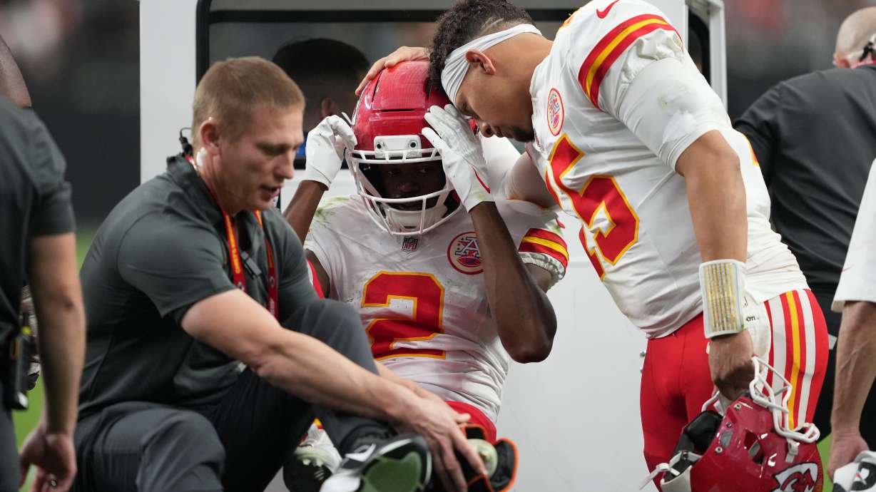 Kansas City Chiefs quarterback Patrick Mahomes (15) talks with wide receiver Tyquan Thornton (2) as he is carted off the field with an injury during the second half of an NFL football game against the Las Vegas Raiders in Las Vegas, Sunday, Oct. 4, 2026.