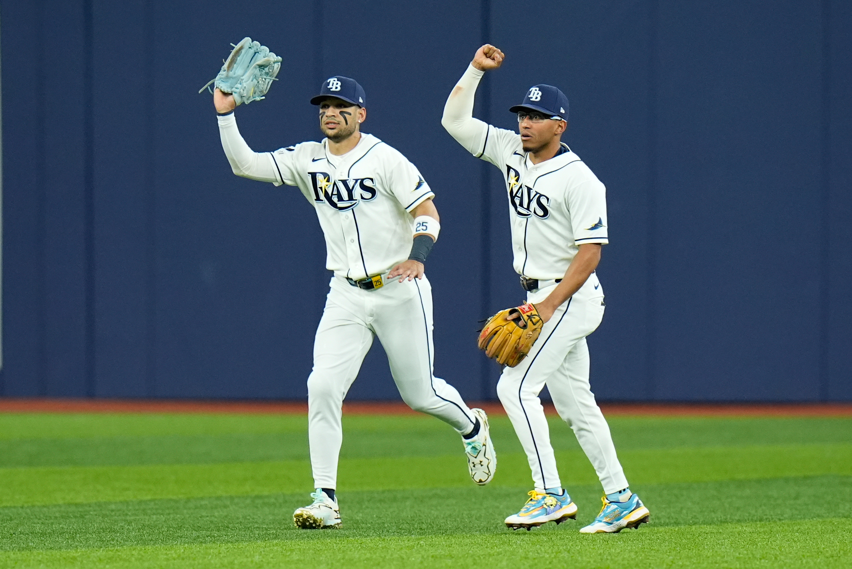 Tampa Bay Rays right fielder Victor Mesa Jr., left, and Rays second baseman Richie Palacios, right, react after Mesa Jr. caught a fly ball hit by New York Yankees' Spencer Jones that hit the ceiling of Tropicana Field for an out during the second inning in Game 2 of an American League Division Series baseball game Monday, Oct. 5, 2026, in St. Petersburg, Fla. 