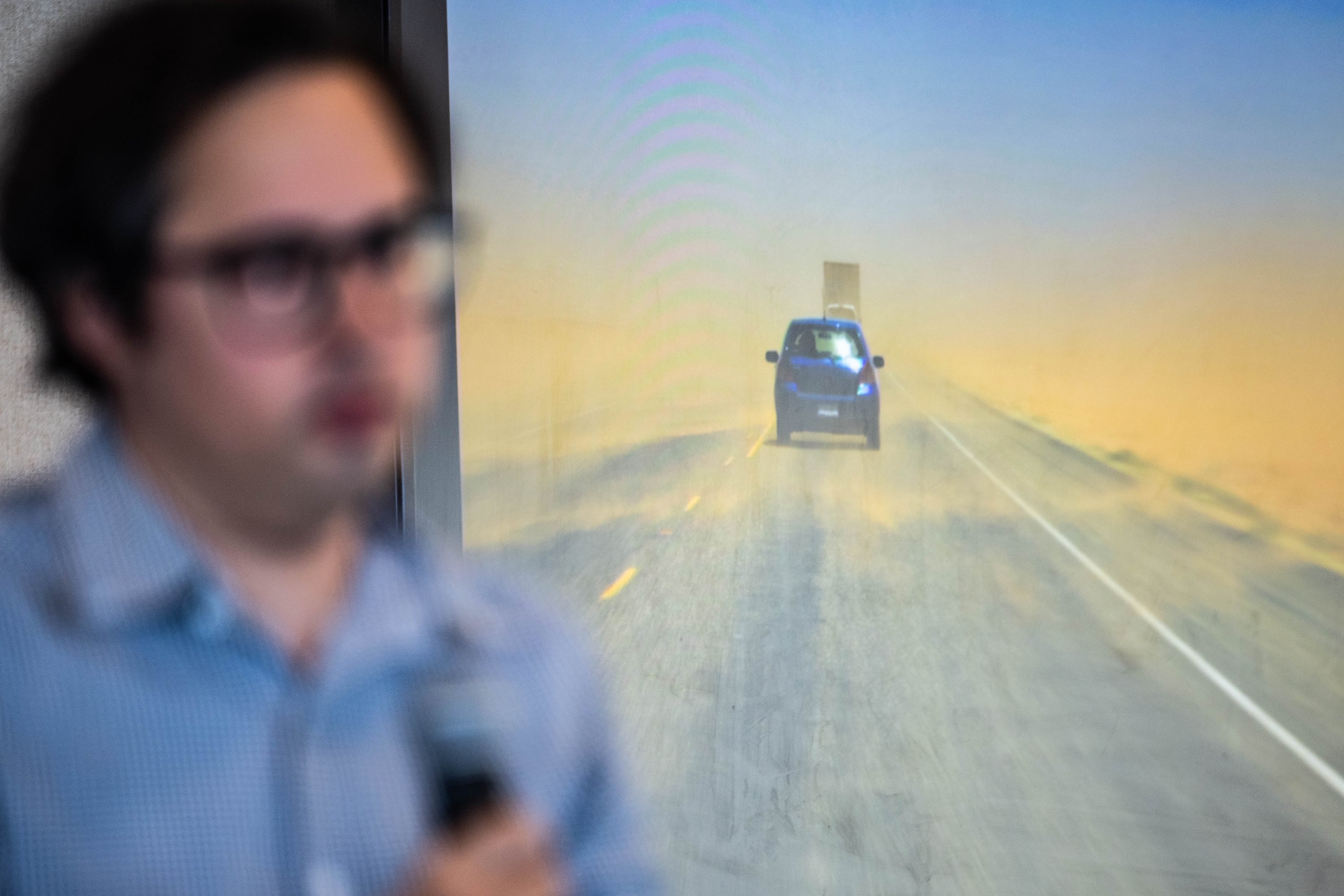 A dust-covered road is shown during a Solutions Series panel hosted by the Great Salt Lake Alliance at the Zions Bank Building in Salt Lake City on Monday.